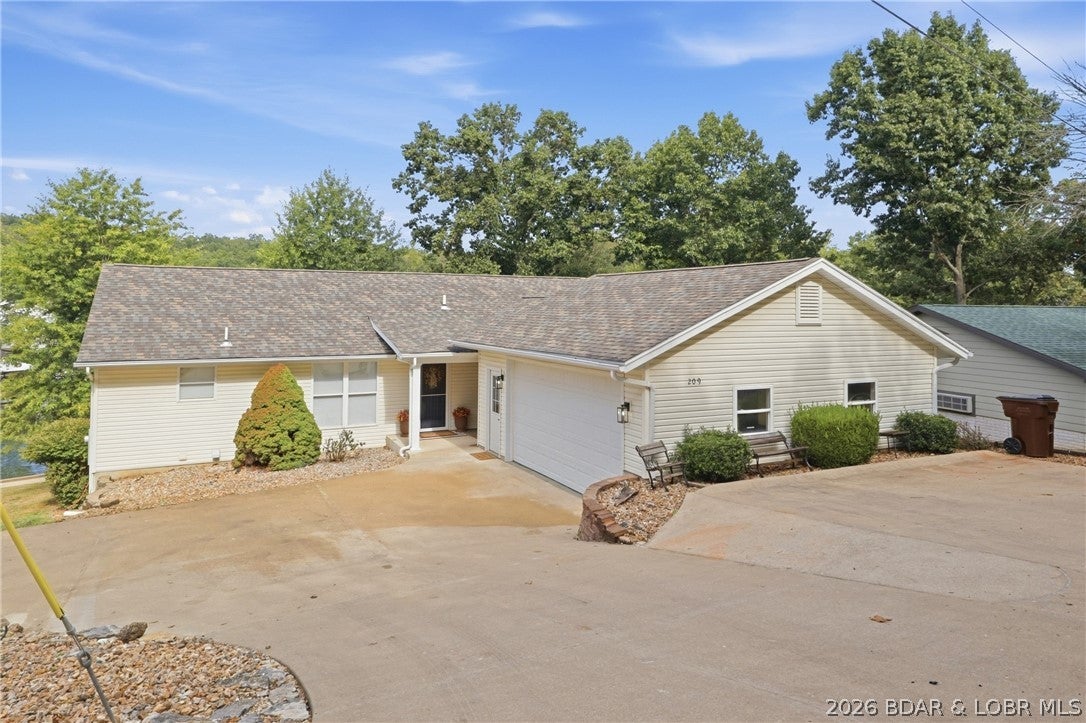 Turnkey waterfront living in the heart of Lake of the Ozarks. This beautifully remodeled 5-bedroom, 4-bath home in Linn Creek combines modern updates with the features that make lake living easy. The open-concept main level is highlighted by a dramatic 12-foot-wide door system that opens directly onto an expansive covered deck, seamlessly extending the living space outdoors. Two additional decks—off the dining area and primary suite—create multiple places to relax and enjoy the lake setting.  The home features three private en-suite bedrooms, two separate living areas, an updated kitchen and thoughtfully remodeled spaces throughout.  Outside, a semi-flat, usable yard provides easy access to the 28x46 private dock w/swim platform, while an attached 2-car garage and excellent parking offer conveniences that can be difficult to find in a waterfront property. Located in Linn Creek with convenient access to both Osage Beach and Camdenton, this move-in-ready property offers the opportunity to enjoy Lake of the Ozarks as a full-time residence, weekend escape or potential vacation rental.