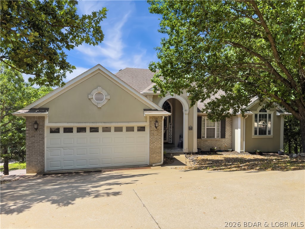Great location in Hawk Island Estates with seasonal Lake View.   Inviting Covered Porch enters to a large Living Room with engineered Hardwood Flooring.  The Kitchen has lots of Cabinets, Work Island, Pantry, a Dining Area & Sliders to a large Deck that is covered & open .  There is also a Formal Dining Room.  The Master Bedroom/Bath also has Sliders to the large Deck, Walk-In Closet, Walk-In Shower, Jetted Tub & double Sinks.  Downstairs is a Family/ Game Room, Fireplace & Wet Bar with Sliders to a large covered Deck.  The 2 Bedrooms downstairs both have Bathrooms & Walk-In Closets.  There is also a large Storage Closet & Utility/Storage Room downstairs.  There is a Community Pool, Tennis Court & Basketball Court for Hawk Island Residents.   Nice location and close to Shopping, Golfing, Hospital & Restaurants.