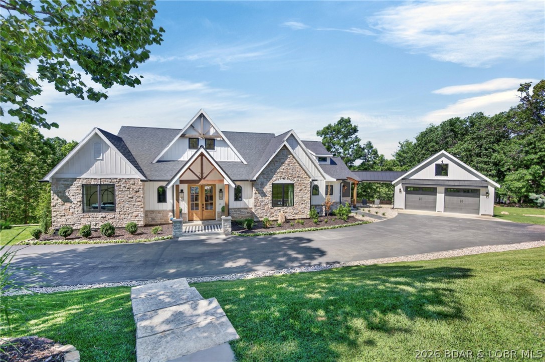 Experience the perfect blend of luxury, comfort & nature in this newly custom-built waterfront retreat. Designed w/ 6 bdrms & 4.5 bths, this home showcases exceptional craftsmanship & upscale finishes throughout. A stunning wall of windows captures beautiful lake views & fills the home w/ natural light. Elegant arched doorways add architectural charm & timeless character, custom cabinetry & detailed millwork elevate the overall design. The LL is an entertainer’s dream, complete w/ a full bar —ideal for hosting family & friends. Perfect for game nights, holidays or summer weekends at the lake, this space was made for gatherings. Step outside to enjoy mornings on the screened-in porch, relax on the expansive deck or gather around the lakeside fire pit for evenings under the stars. W/ generous acreage, waterfront access & privacy, this property offers a rare combination of land, luxury & tranquil lake living, located by popular restaurants, golf courses & attractions. A 2-C garage is complemented by extensive driveway space, providing plenty of parking. More than just a home, this is a private waterfront sanctuary w/ views & peaceful surroundings allowing you to truly relax & breathe.