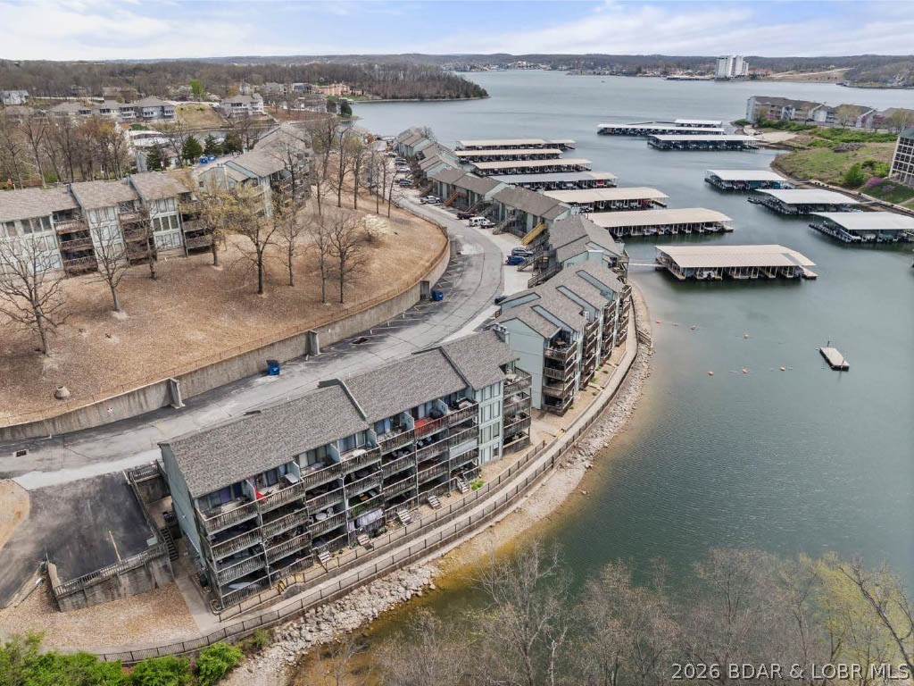 MAKE AN OFFER! Lakefront, professionally remodeled, and priced to sell. Turn key opportunity for a personal getaway, full time residence or investment property, this condo offers a perfect blend of comfort, convenience, and affordability. Located in the sought-after Southwood Shores gated community, you will enjoy resort-style amenities including year round indoor hot tub, an outdoor swimming pool, clubhouse, tennis courts, close to several golf clubs, fishing station, dog park, playground, onsite boat ramp and trailer storage. Boat Slip available for purchase, giving you the opportunity to complete the ultimate Lake of the Ozarks lifestyle. Short Term Rental allowed.
Why buy a project when this one is ready to go? Take advantage of a professionally remodeled condo being offered at an exceptional value. Square footage is based on the appraiser's measurements from the appraisal.