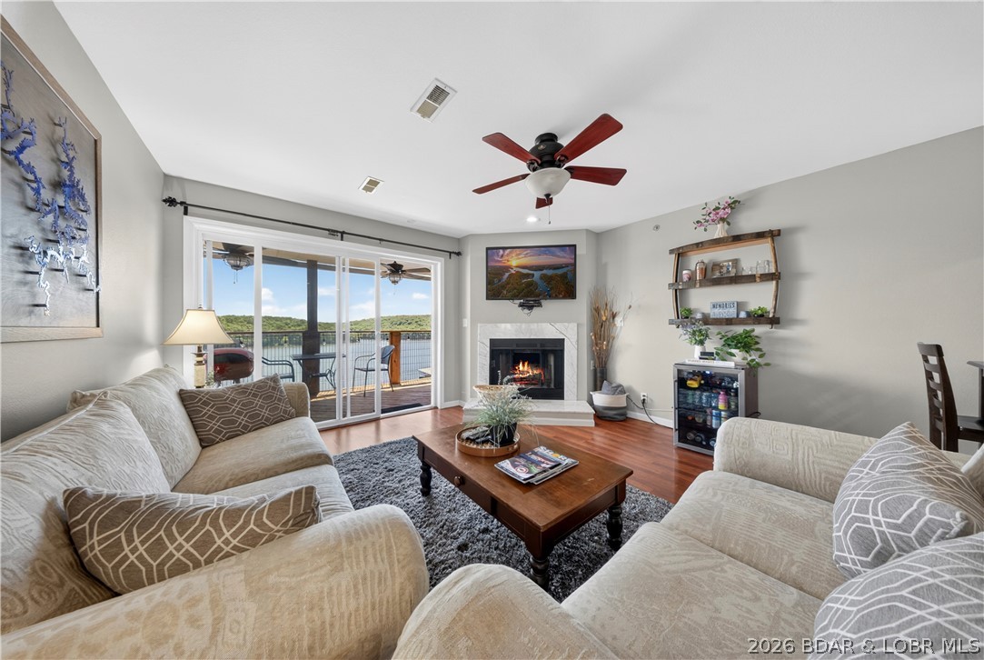 Experience lake living surrounded by nature & green spaces in this beautifully maintained 3-bed, 2-bath condo offering breathtaking views of the 5MM of the Lake of the Ozarks State Park. Perfectly positioned near popular waterfront attractions, restaurants, entertainment, and local hot spots, this property combines convenience, comfort, and incredible scenery in one ideal package.

Inside, you’ll find a spacious open-concept layout designed for both relaxing and entertaining. The large living area flows seamlessly into the dining and kitchen spaces, all enhanced by abundant natural light and stunning lake views. The oversized primary suite features a private en-suite bathroom and plenty of room to unwind after a day on the water. Two additional bedrooms provide ample space for family and guests.

Step outside to the covered deck and enjoy peaceful mornings, unforgettable sunsets, and panoramic views of peace & serenity. The well-maintained condo complex offers pride of ownership throughout, making this property an excellent choice for a full-time residence, vacation getaway, or income-producing investment opportunity. Don’t miss your chance to own a piece of lakefront paradise!
