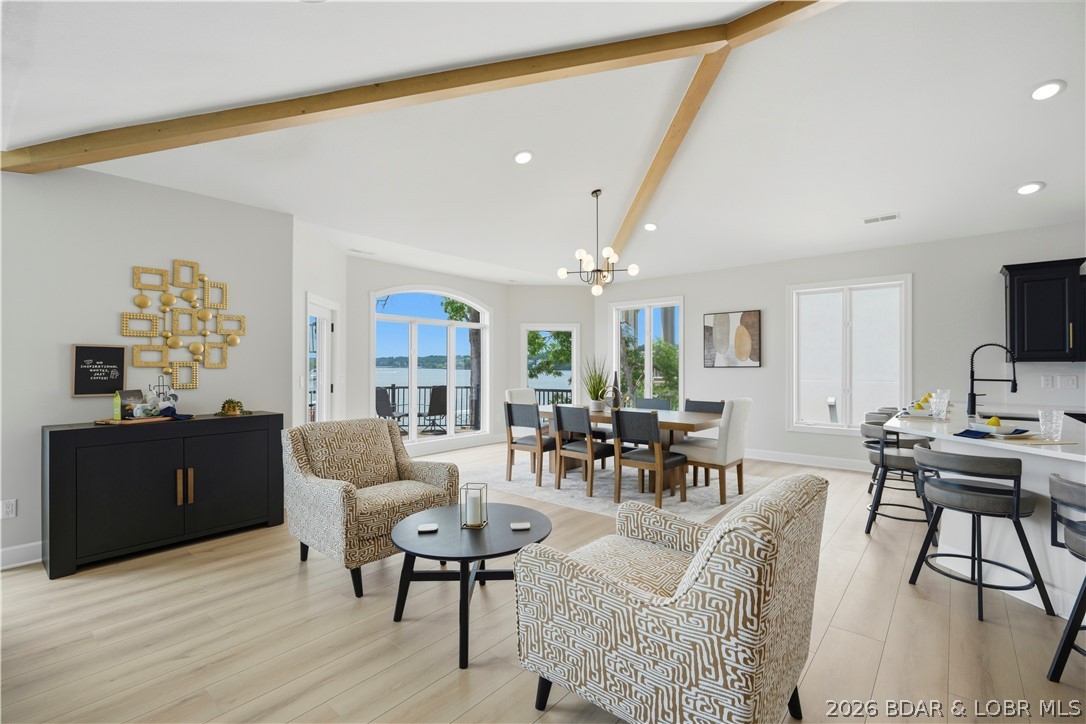 Experience lakefront living at its finest in this beautifully updated and TURN KEY home located in the prestigious Porto Cima area. Perfectly positioned on the 14-mile marker with breathtaking main channel views and protected cove docking, this exceptional property offers over 4,700 square feet of thoughtfully designed living space. The home features 4 bedrooms, 4.5 bathrooms, soaring vaulted ceilings, and walls of windows that showcase panoramic Lake of the Ozarks views from nearly every room.  Recent improvements make this property truly move-in ready, including extensive interior updates and a newer dock designed for effortless lake enjoyment. Host family and friends on the expansive lakeside deck, or spend the day on the water from your private dock. With approximately 87 feet of shoreline, easy access to the water, and stunning sunset views, this home delivers the ultimate Lake of the Ozarks lifestyle.