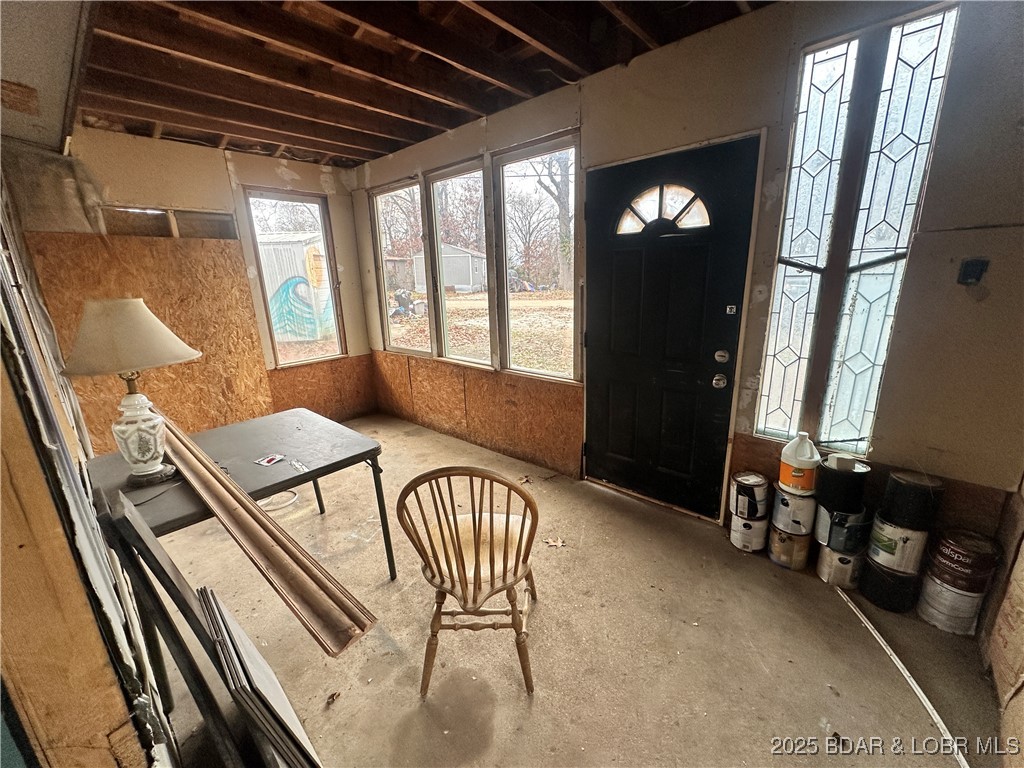 MOTIVATED SELLER! Are you looking for a project with real potential near Lake of the Ozarks? This Edwards property sits on just over 1/2 acre, and offers several solid structures and community lake access, making it a great option for a rental investment, weekend getaway, or future full-time home. The main residence is a 1970 single-wide trailer with a metal roof and a very nice addition that services as a great living space. The structure appears to be in good condition, but the interior will need updates, including plumbing, heating/cooling, flooring, and appliances. The property also includes a single-car detached garage, a small storage shed, a large, well built earth contact 2-car garage at the back of the property. This property includes a total of 6 lots in the Arrowhead Lakes Subdivision so is a spacious spot that needs a little love. If you’re looking for a fixer-upper with multiple outbuildings and room to make it your own, this one is worth a look. Bring your ideas, your tools, and your vision — there’s a lot of possibility here. Owner is selling AS-IS.