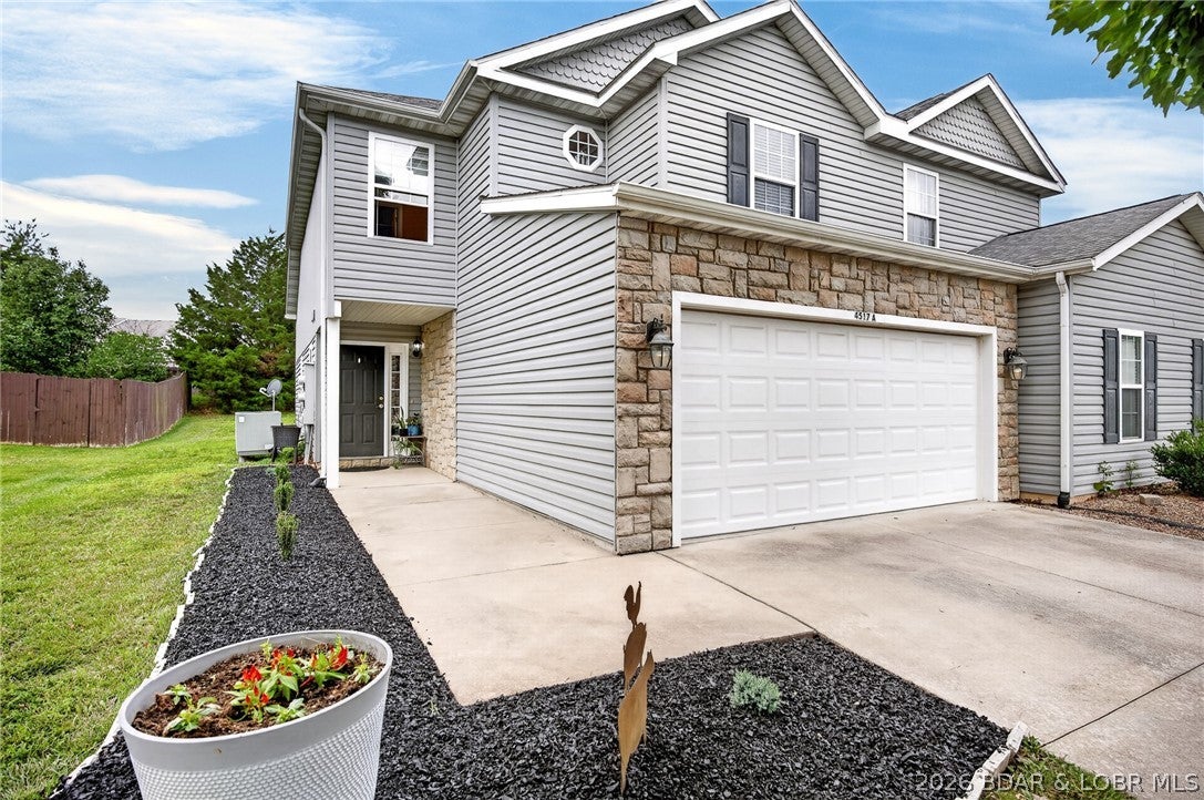 INVESTORS @ Lake of the Ozarks. This is a GREAT BUY in heart of Osage Beach & will RENT WELL, cuz its just a few minutes to almost everything + the Expressway. Classy 2 Story TOWNHOME w/ desirable Floor Plan SHOWS VERY WELL & has a LOW, LOW $50/mo HOA FEE which includes MAINTENANCE FREE Nice Flat Grassy IRRIGATED Yard, managed by HOA. This very clean, nice, friendly & quiet Neighborhood is also IDEAL for a Permanent Home w/1656 SqFt, 3Bed/3Ba, Spacious/Lovely Kitch w/SS Appl’s, Lots of Cabinets +Counters, Walk-in Pantry & Brkfast Bar to keep the cook company. Spacious Mast Bdrm w/Roomy Sitting/Office Area, Cathedral Ceil’g & 2 Lrg Windows. Lrg Master Bath w/ His & Her Closets. 2 Guest Bdrms w/Walk-in Closets & Coffered Ceil’gs all on the same floor. Bright Din'g Area just off Kitch. Covered Patio off of Din’g Rm. Laundry Area w/Washer & Dryer. Lovely Landscaped Walkway. Sidewalks on a Cul-de-sac Street. Attached VERY NICE clean, finished 2 Car Garage w/Drywall & Extra Park’g in Driveway. Minutes to New Entertainment Park & Malls, Restaurants, Groceries, Hospital. 2 Marinas w/in 1-3 min w/ BOAT SLIPS to Rent. Camdenton Schools. MUST SEE Detailed EXTRA FEATURE SHEET for MORE DETAILS.