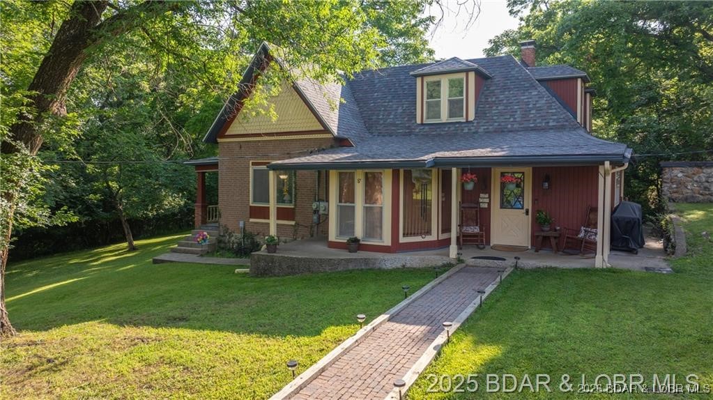 Own a piece of historic Old Linn Creek with this beautiful and well maintained home from 1884 just steps to the lake! This gorgeous brick home features 4 bedrooms, 2 bathrooms, and approximately 1.6 acres for your enjoyment. There is also plenty of room for your hobbies and storage with an RV pad and detached shop/garage. Although there are still pieces of the home from 1884 this home has had many updates through the year such as a new roof in 2022, new well pump and tank in 2015/16, and several others - it's the perfect mix of historic and new for you and your family to enjoy! The land is flat and secluded, with an outdoor fire pit ready to create countless summer memories with no HOA to worry about. This will be a house you never forget about, check it out today!!