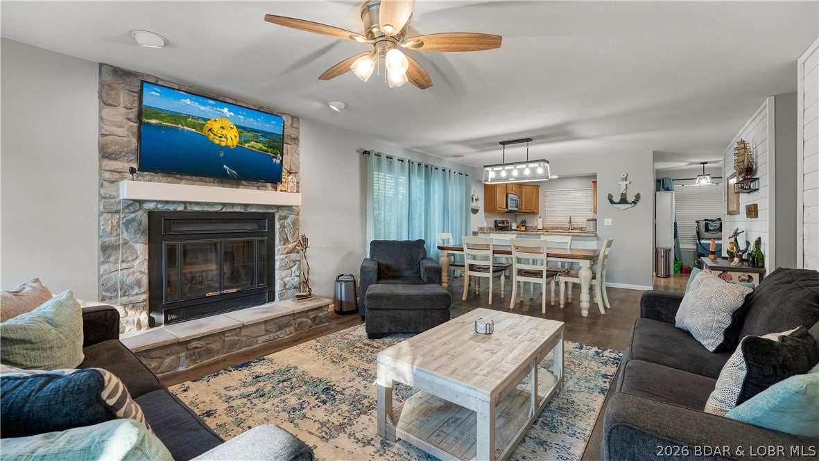 Location is everything, and this 2-bedroom, 2-bath condo puts you right in the heart of Osage Beach! Enjoy a prime location by both land and water, just minutes from popular waterfront destinations and within walking distance of Michael’s Steak Chalet, with golf, shopping, dining, and entertainment nearby. Inside, the functional floor plan features comfortable living spaces, a spacious primary suite with private bath and deck access, and a welcoming living room highlighted by a beautiful stone fireplace. Step outside to the large deck and enjoy scenic views of Lake of the Ozarks. A slip lease is included, and a golf cart is available for purchase, making trips to the water’s edge a breeze. The condo may also be purchased furnished for an easy transition. Whether you’re looking for a full-time home or weekend getaway, this is a great opportunity to own in one of Lake of the Ozarks best locations!