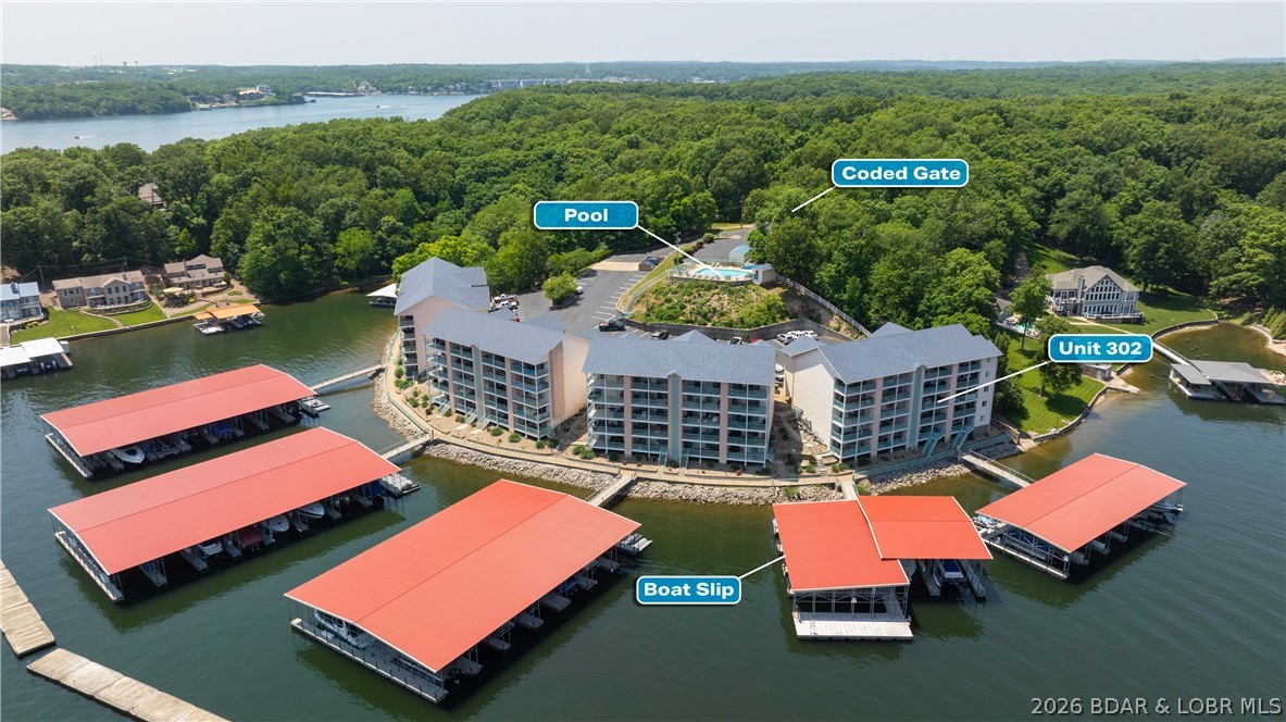 Turnkey lakefront condo at the 19 MM of the Osage Arm in Harbour Bay! This recently updated unit is ready for immediate enjoyment with new laminate flooring, fresh paint, new carpet in 2024, and new appliances. Offered fully furnished, this condo makes lake living easy whether you’re looking for a weekend retreat, full-time residence, or investment opportunity. Enjoy beautiful Lake of the Ozarks views and the convenience of a 14x40 boat slip located just below the unit, giving you quick access to your boat and the water. By boat, Harbour Bay is close to popular lakefront restaurants including Dog Days, Shorty Pants, and RedHeads. Harbour Bay is a gated complex with a community pool, adding extra comfort and convenience. With updates already completed, furnishings included, and a large boat slip in a prime Osage Arm location, this lakefront condo is a complete package.