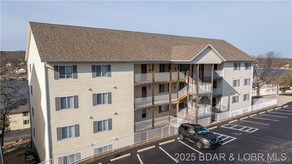 This well maintained, 2nd tier, Ledges Condo, with a lake view, comes fully furnished, along with a 12 X 40 foot slip. There's a newer A/C unit, along with a dishwasher and hot water heater. The Ledges Condo Complex is a prime location for both relaxation and investing. The savvy investor will be able to supplement their purchase with several rental options. The family will love the sand beach and the two pools. Plus you’ll be in the heart of Osage Beach, close to local restaurants and entertainment. The covered deck has been replaced and the special assessment has been paid. Come and enjoy The Ledges and The Lake of the Ozarks and all they both have to offer.