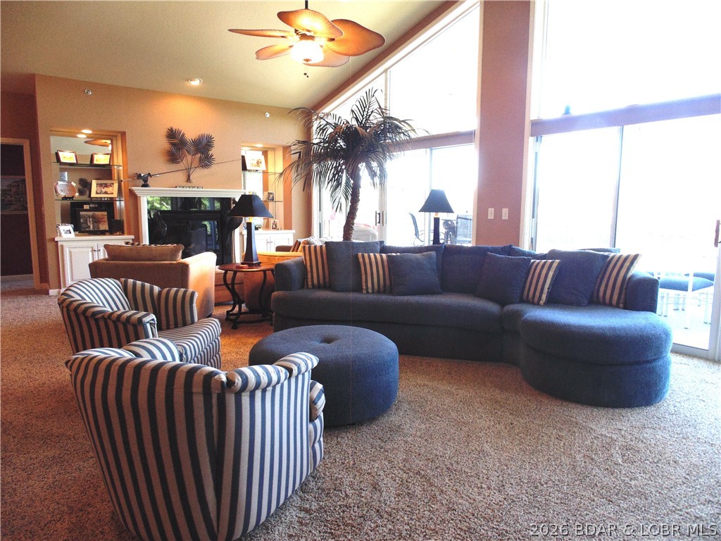 LUXURY SUMMER PLACE CONDO at Lake of the Ozarks – TURNKEY! This stunning top-floor condo that sits next to the timber offers 3 bedrooms, 3.5 baths, and is packed with luxury upgrades throughout. You’ll be wowed by the vaulted ceilings and exceptional attention to detail. This condo has a fabulous open floor plan that perfectly combines comfort and style.The spacious living area opens up to a large screened deck offering an amazing view of the lake. The kitchen features custom cabinets with granite counter tops. The lakefront primary bedroom has all the options and the other 2 bedrooms offers en suites that are spacious and provide peaceful, private retreats. The screened deck is perfect for entertaining. This condo comes furnished and includes a 12 x 38 boat slip w/hoist, 2 PWC Slips w/hoist providing all the amenities you need for lakeside living. Garage Available If Needed. Summer Place is an exceptionally well-maintained complex, located at the 35mm, and offers 2 pools, a clubhouse, and pickleball courts, making it a resort-style experience right at home. Don’t miss out on this incredible opportunity – schedule your showing today!