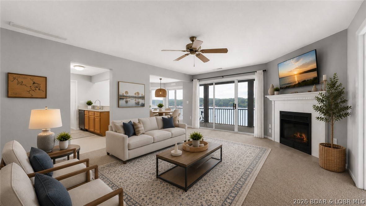 NOW OFFERING ALL HOA assessments for 2026 paid by seller upon successful offer!The VIEW is what sets this condo apart! Located at Windsor Bay Condominiums, this turn-key 3 BATH / 3 BATH end-unit offers breathtaking panoramic views of the Osage 34MM from its spacious screened-in & covered deck—perfect for enjoying the lake in any season. End-unit positioning provides additional side windows, filling the condo with natural light while maximizing the incredible lake views. All 3 beds feature private bathrooms & the larger-than-average kitchen offers abundant cabinet & counter space, rarely found in condo living. Includes a 10x30 boat slip WITH lift, PWC space (dock 3/slip 2L) & a private storage closet just outside the front door. The complex has recently undergone major improvements including a new roof, new siding, new railings & freshly sealed parking lot. Coming soon is a new pool liner & renovated pool deck scheduled for Fall 2026. Enjoy the lakeside clubhouse featuring a full kitchen, fitness equipment, games, fireplace & stunning lake views. The elevated pool deck offers some of the best views in the complex, while the docks are protected by a wavebreak for added peace of mind.