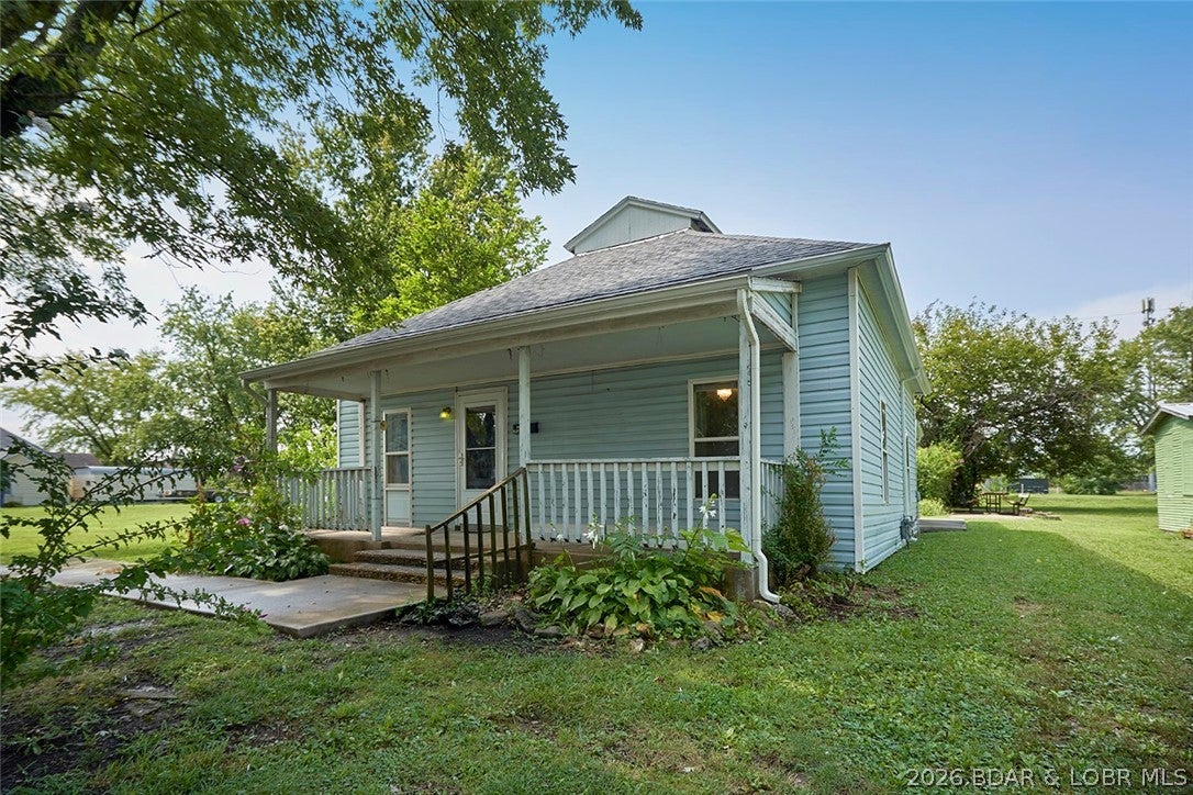 ELDON BARN BURNER! ?? The perfect investment opportunity in town, just a short walk to historic Downtown Maple Street and Gerbes grocery market. This 2-bedroom, 1-bath home offers LARGE closets, a spacious yard with mature shade trees, and plenty of potential for a savvy investor or first-time buyer looking to build equity. A long-term tenant recently moved out, making this home ready for its next chapter and a little TLC. The oversized kitchen features unique stainless steel countertops, while the bathroom has reinforced flooring and preserves the charm of the original cast iron tub/shower combo. Newer vinyl flooring flows from the kitchen into the bathroom, and the roof was replaced just a couple of years ago. Located in a quiet, walkable neighborhood close to town conveniences. Sold AS IS—bring your vision and turn this affordable property into your next rental, renovation project, or home sweet home! Envision rocking chairs on the covered front porch or BBQ for all your friends & family on concrete patio out back!