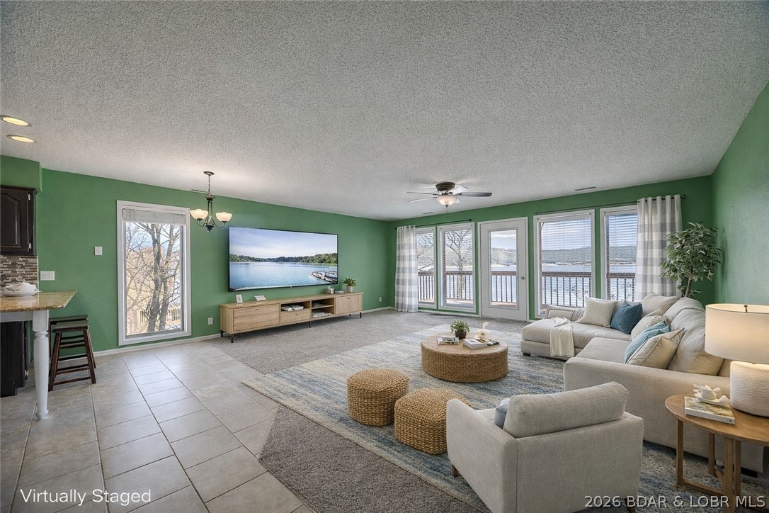 This isn’t your typical lake condo—step inside and you’ll feel the difference. From the moment you walk in, the elevated setting, natural light, and long lake views make the space feel open, bright, and more expansive than most. Windows positioned from multiple angles bring the lake into the living space, creating a layout that just feels right.

Designed for relaxing weekends or hosting, the living area flows into a full kitchen and out to a large covered deck—accessible from the living room and primary suite—offering front-row views of the main channel and peaceful, glowing sunrises that set the tone for the day.

Recent updates include HVAC (2023), water heater and softener (2022), fresh paint, new flooring, light fixtures, and granite countertops. Includes a 10x24 slip with 4,500 lb lift and dock storage, plus access to a community fish cleaning station.

Major bonus: sellers are covering the special assessment—meaning brand new front and back decks for the next owner.

Located minutes from Ha Ha Tonka, Old Kinderhook, Lake Valley Golf Course, and local favorites like Nautifish and Fish & Co—this is easy lake living in a setting that stands out.