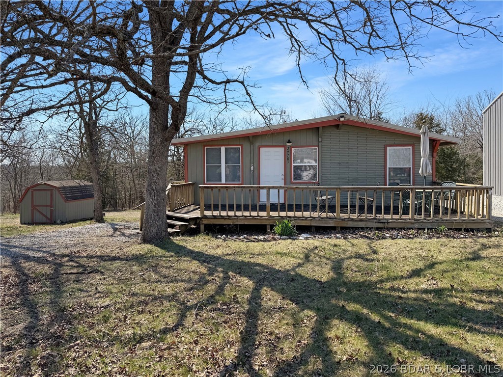 Enjoy the ease of lake living in this updated home with a swim dock, offering convenient access to the water for boating, fishing, and outdoor recreation. Renovated in 2017, this property features two bedrooms and an open-concept layout connecting the living, dining, and kitchen areas, creating a comfortable space for everyday living and entertaining. The kitchen includes appliances, and a stacked washer and dryer are located in the bathroom for added convenience. A deep soaking tub with a shower wand provides a relaxing place to unwind.

Situated near the 80 mile marker of the Lake of the Ozarks, this property offers access to a variety of recreational opportunities. Set on two lots, there is additional space for future improvements such as expanding the home or adding a garage. The property is being offered furnished, providing a move-in-ready opportunity.