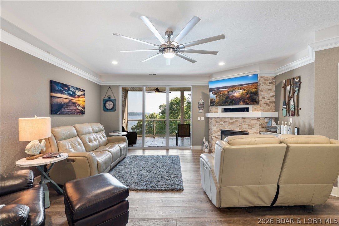COMPLETELY REMODELED & TRULY TURNKEY! This stunning Trinity Pointe condo has been transformed from top to bottom with high-end finishes and attention to every detail. Featuring new tile and luxury vinyl plank flooring, quartz kitchen countertops, granite bathroom counters, new cabinetry, stainless steel appliances, custom lighting, toilets, fireplace, water heater, washer & dryer and so much more—literally everything feels brand new! The primary suite features gorgeous custom rain-glass barn doors for an added touch of luxury. Sold fully furnished with beautiful, quality furnishings, making this one ready to enjoy from day one. Relax on the large screened-in, tiled deck with additional storage, while the desirable end-unit location provides exceptional privacy. An oversized garage, elevator access, and a 12x32 boat slip with 6,000-lb boat lift featuring a Captain’s Choice remote complete the package. An incredible opportunity at Trinity Pointe! 2021 Bennington Tritoon available for extra!