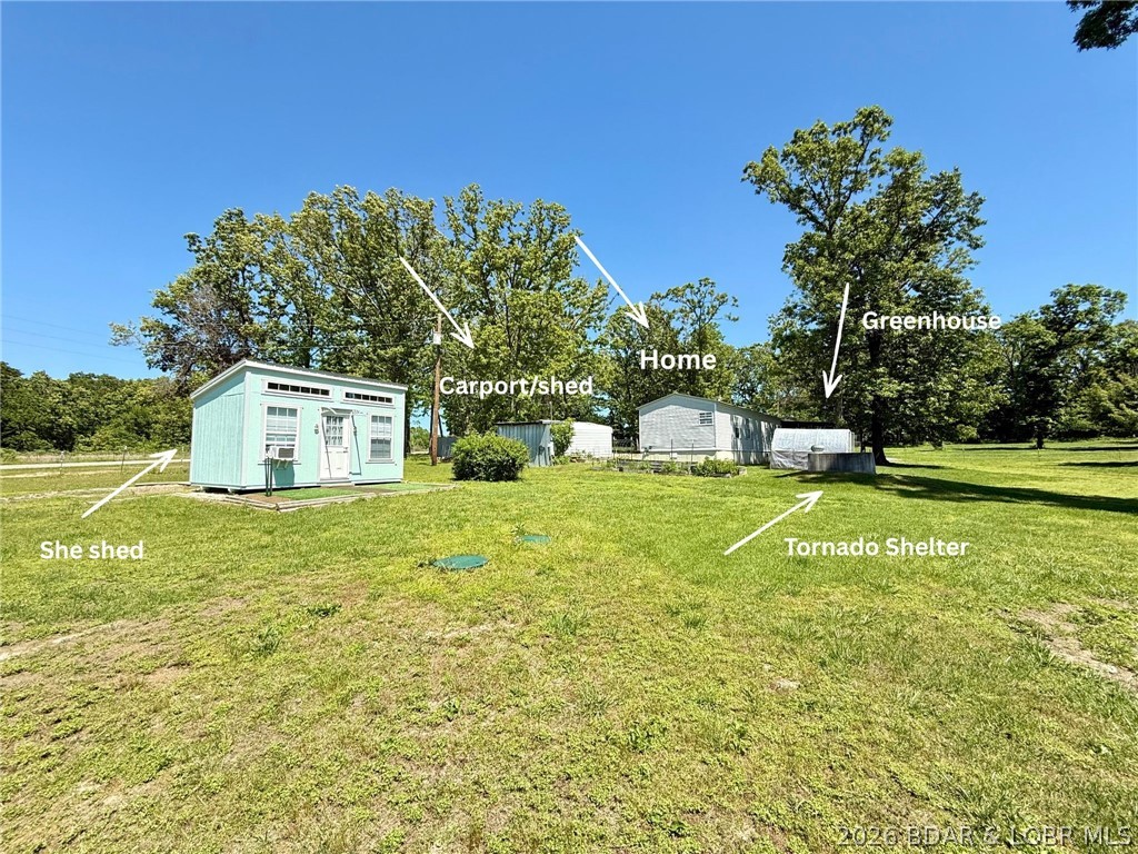 Usable acreage, outbuildings, and live/work potential all come together on this 4 acre property with Highway frontage. The 2 bed, 2 bath home features a comfortable layout, screened-in porch, and an additional office space if needed. Outside, you’ll find multiple amenities including tornado shelter, chicken house, greenhouse and garden area already started. One pasture includes large 3-bay metal barn, lean-to and carport all ready for your animals and storage. Next to the home includes a garage with concrete floor and electricity another carport for your vehicle and additional metal building for storage. Another added bonus is the most adorable 2023 She/He Shed that adds the perfect touch of charm ideal for hobbies, storage, gardening supplies or a quiet little creative escape. The land lays level with a walking path at the back of the property and peach and apple trees already started. With usable fenced acreage and 3 pastures cross fenced there is room for animals, tools, toys, or a home-based business, this property is ready for its next chapter. Come take a look today and see all the potential this property has.