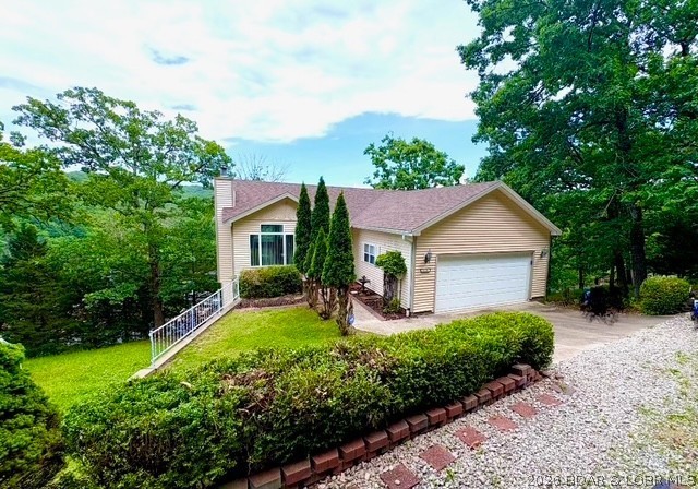 Want the Lake Life w/ all the benefits of Lake Living- uninterrupted views of the state park, open air deck for evening gatherings under the stars, tucked away at the end of the road, centrally located to shopping, dining, entertaining & all the amenities you want at the Lake- here it is!  Setting grandly in the Parkview Subdivision, this home offers 3 br/2.5 baths, main floor living w/ private living quarters for guests in the lower level of the home.  Become your own HGTV design star as this 2nd tier home provides a pallet for you to create & update the traditional motif into something modern & hip- the vaulted ceilings elevate the room w/ a grand open feel whereas the 12’ ceiling in the lower level maximizes the feeling of space & light.  The flow of the kitchen opens spaciously into the living area; & the additional living area in the lower level can be turned into an entertaining space, or even a 4th bedroom. Snuggled in the trees of the Ozarks, the home is like a treehouse in the woods w/ a lake view- check it out today!