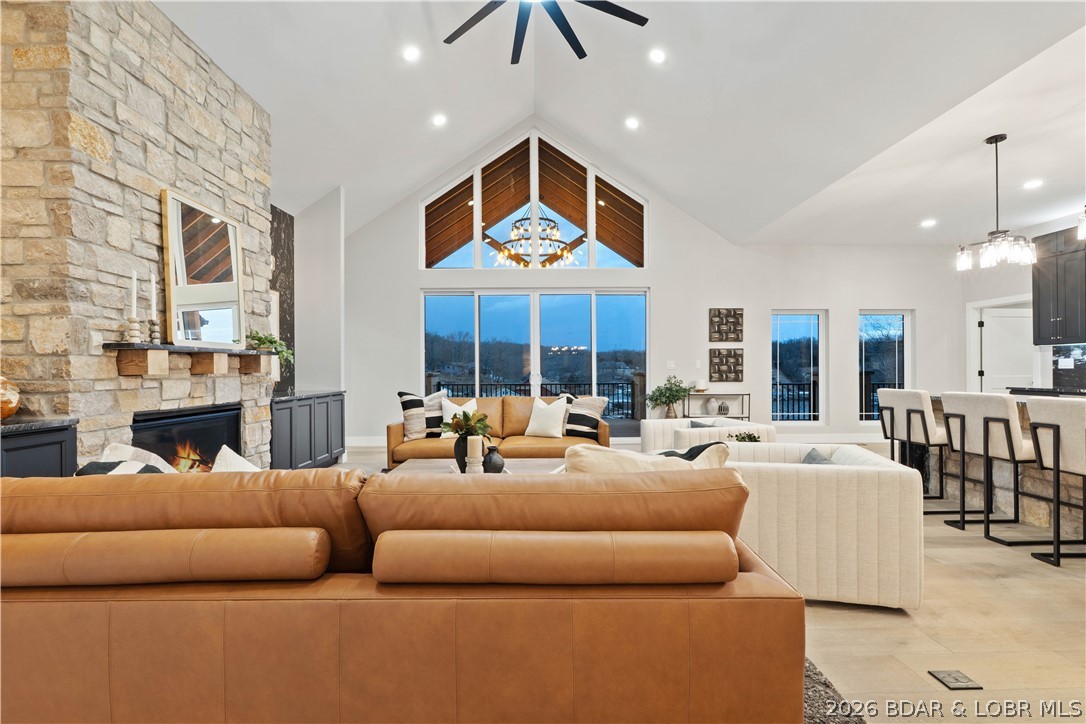 Attention INVESTORS: Luxury lake living with the COMPLETE PACKAGE—POOL, BIG-BOAT DOCK, DEEP WATER, AND GARAGE SPACE! This brand-new lakefront home offers soaring ceilings, walls of windows, expansive concrete decks & incredible views. The gourmet kitchen features high-end appliances, formal dining & a breakfast nook. The lakeside primary suite includes a spa-like bath, large walk-in closet & laundry access, plus 2 additional en-suite bedrooms on the main level. Downstairs you'll find a family room, 3 more bedrooms (one en-suite), custom wine cellar, second laundry & abundant storage. The pool room with bar & full bath opens directly to the 13x27 pool and spacious deck. Exceptional dock setup includes a 16x50 slip, 12x36 slip, PWC slip & a filled-in 12x50 slip that can be converted for a performance boat. Oversized 3-car garage, extra parking, 10' golf-cart path to the water with turn around area, deep-water cove, city water/sewer & quick main-channel access. Rental projections exceed $250,000. Owners have priced this to sell. Call for to schedule your private tour TODAY!