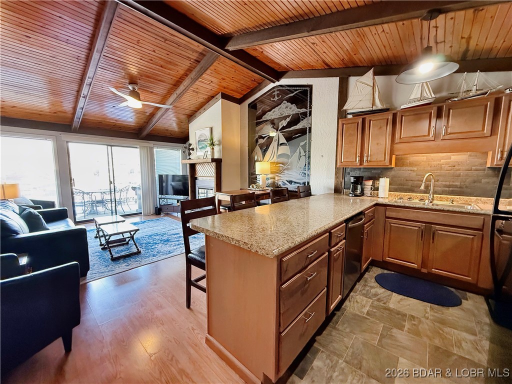 Enjoy lake living at its best in this beautifully maintained 2-bedroom, 2-bath condo in the Southwood Shores community on Horseshoe Bend in Lake Ozark.   This top-floor unit offers a great view of the lake from the open deck area with new aluminum railings. Plus you are just steps away from the point pool.   The nice kitchen features ample cabinet space and flows seamlessly into the living and dining areas, making it ideal for entertaining or relaxing in front of the fireplace.    This unit also includes a boat slip close by, making it easy to enjoy all that Lake of the Ozarks has to offer.  Can enjoy this unit year-round with an indoor pool, hot tub, tennis/pickleball/basketball courts, playground area as well as the outdoor pool on the point.  Currently on a rental program, this property provides the flexibility as a personal retreat, full-time residency or investment opportunity.     Plan your visit today.