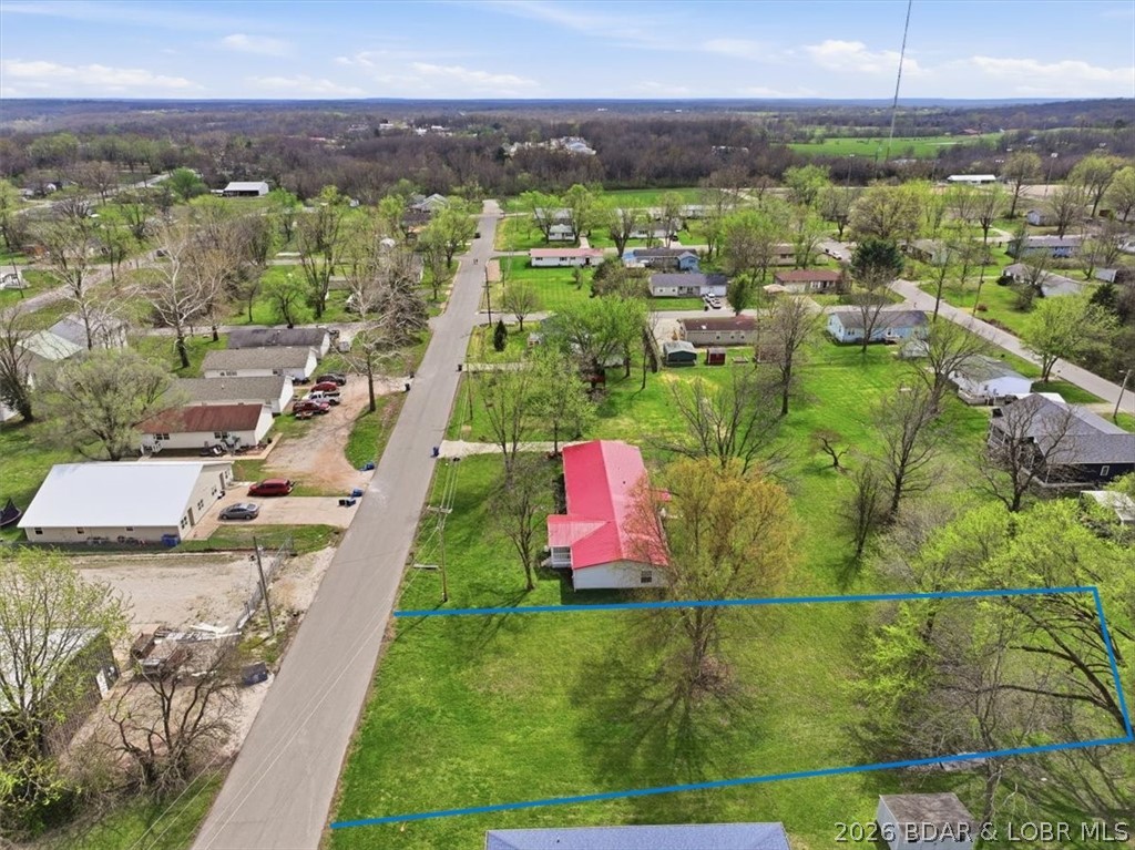 Discover a fantastic opportunity to build your dream home on this spacious vacant lot in the heart of Eldon, MO! Nestled in a friendly neighborhood, this large lot offers ample space for your vision. Enjoy the convenience of being within walking distance to a beautiful park and ball fields, perfect for family outings and outdoor activities.Eldon is experiencing a boom in both job opportunities and new businesses, making it a vibrant and growing community. With its welcoming atmosphere and community spirit, you'll love living in this area that combines small-town charm with modern amenities.Don't miss out on this rare chance to secure a prime piece of real estate in a thriving location. Whether you're looking to invest or start fresh, this lot is ready for you to make it your own. Take advantage of the growth happening in Eldon and create the lifestyle you’ve always wanted! Broker Owned