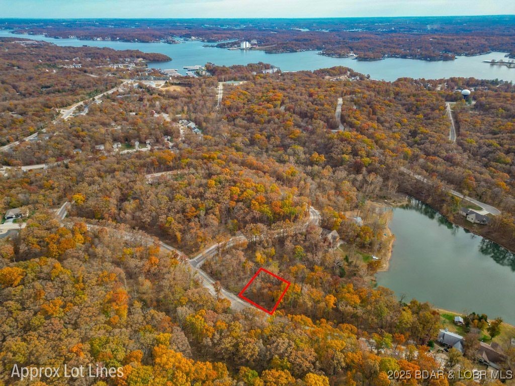 Build your dream home! Are you searching for an affordable lot with a seasonal view and access to one of the few interior lakes in Four Seasons with full Four Seasons amenities? Look no further—this property is worth a visit. You’ll be conveniently located near the dog park, fitness center, walking paths, boat ramps, shopping, medical facilities, dining, and more. Plus, you're just minutes away from all the attractions at Bagnell Dam.