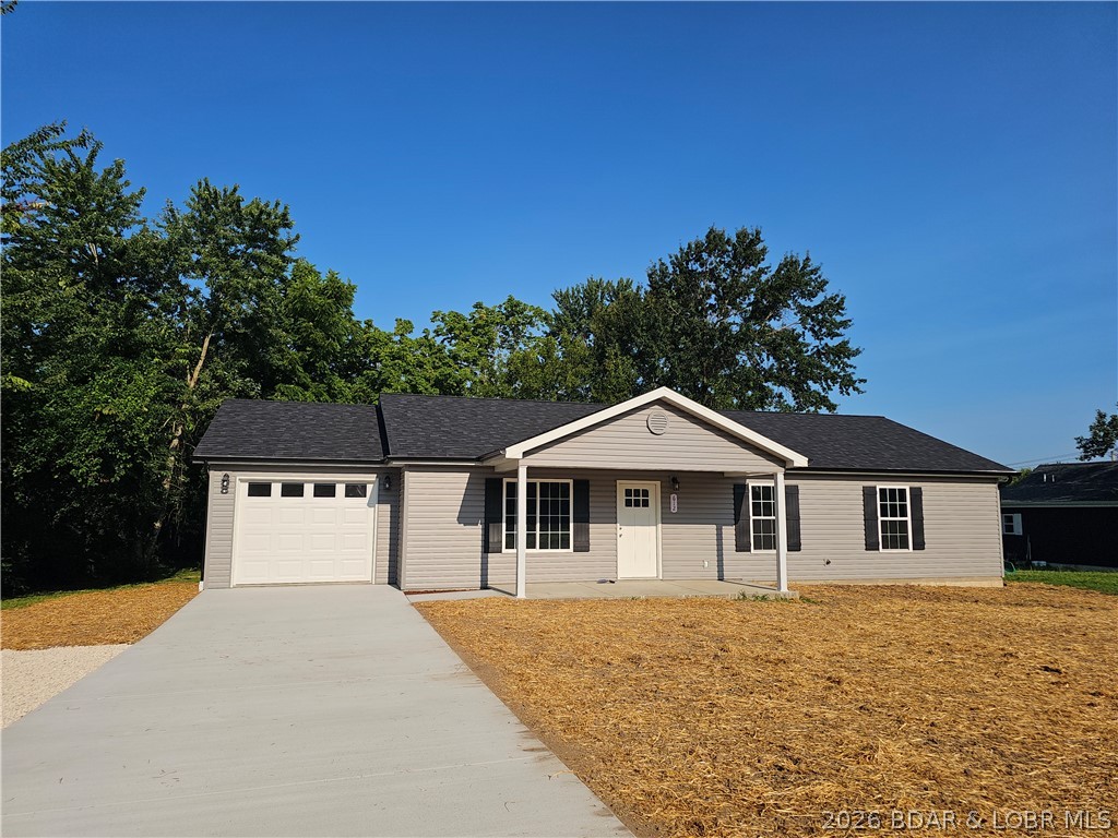 Welcome to 612 E. 8th Street in Eldon, MO! This brand-new construction offers easy one-level living with 3 bedrooms, 2 bathrooms, and an attached garage with a concrete driveway. Situated on a private, level 100x100 lot, this home features a covered front entrance and a back deck—perfect for relaxing or entertaining. Inside, you’ll find a modern, low-maintenance design with vinyl flooring throughout (no carpet), all-electric systems, stainless steel appliances, and a stylish tile backsplash. The spacious master suite includes a walk-in shower for added comfort and convenience. Built with maintenance-free siding and designed for today’s lifestyle, this home combines quality and efficiency. Estimated completion date is July 1, 2026. Located in a growing community with strong employment opportunities and a highly regarded school system—this is a great place to call home! Photos of finished rooms are from a previous build and are provided as a representation of the builder’s typical aesthetic, craftsmanship, and overall quality of the completed product. Appliances Coming Soon!
