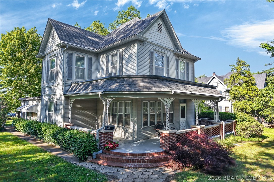 Offered for the first time in over 40 years, this is a rare opportunity to own a charming Victorian home in Eldon. Nestled on a corner lot and backing directly to the city park, this property offers both character and an unbeatable location.  From its classic Victorian design to its original details, it reflects an era of craftsmanship and character rarely found today.Thoughtfully maintained over the years, the home reflects a genuine pride of ownership. From the moment you arrive, the inviting wraparound front porch makes a lasting impression—perfect for relaxing and taking in the charm of the surrounding neighborhood. Step into the grand front parlor, a hallmark of early 1900s Victorian design, ideal for entertaining or a stunning sitting room. Inside, original leaded glass windows showcase the artistry and detail that define this special home. Bring your vision and make this historic gem your own while becoming part of its enduring legacy. This home is in an estate and being sold as is.