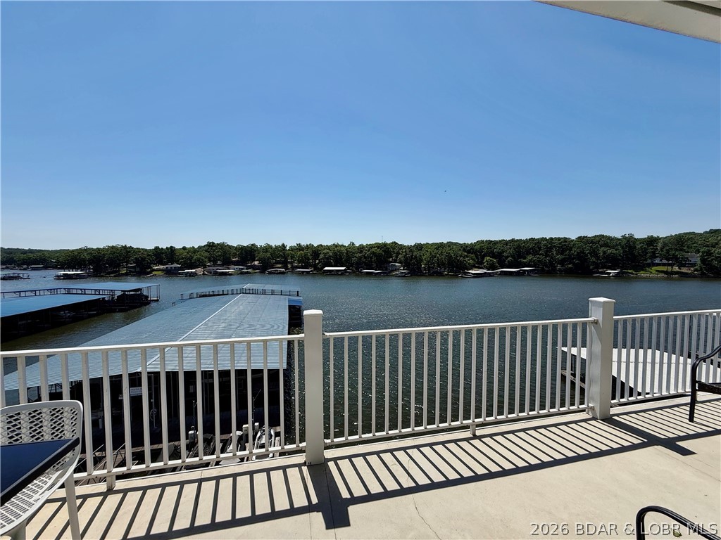 Lake life just got a serious glow-up! This beautifully remodeled 4-bedroom, 3-bath lakefront condo offers the perfect blend of modern style, comfort, and investment potential. Completely updated in 2023, the interior features luxury flooring, fresh paint, a stunning kitchen with stainless steel appliances, and stylish finishes throughout. 
Step outside to the spacious lakefront deck and take in the breathtaking views of Lake of the Ozarks. Boating enthusiasts will love the included 12x30 boat slip, making it easy to get out on the water whenever the mood strikes.
Whether you're looking for a full-time residence, weekend retreat, or vacation rental investment, this property checks all the boxes with excellent income-producing potential. Owners and guests can also enjoy the lakeside community pool, offering the perfect place to relax and soak up the waterfront lifestyle.
Conveniently located just minutes from shopping, dining, golf, and entertainment, this condo delivers everything you love about Lake of the Ozarks—without the maintenance. Schedule your showing today and start living the lake life you've been dreaming of!
