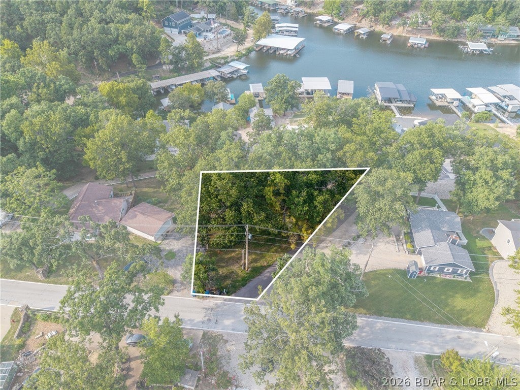 In the heart of Osage Beach, this Malibu Road lot offers stunning views of the Grand Glaize Arm and a gentle slope—perfect for building your lake getaway. Located within walking distance of The Moorings, this property is an excellent opportunity for a second-tier home with available boat slips just steps away!