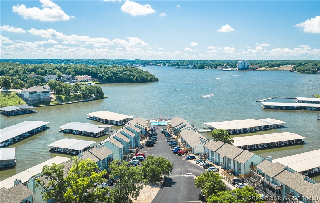 Experience effortless lake living in this turnkey 1-bedroom, 1-bath lakefront condo complete with a coveted 10x24 boat slip. Conveniently located just one flight down from parking, this beautifully maintained retreat is offered fully furnished, making it ready for immediate enjoyment or investment potential.

Inside, you'll find thoughtful updates including a new garbage disposal, toilet, water heater thermostat, and electrical box, along with recessed lighting with dimmers throughout, elegant tray ceilings accented with crown molding, and an open, inviting atmosphere perfect for relaxing after a day on the water. Whether you're enjoying your morning coffee or returning from a sunset cruise, this condo is designed to make every day feel like a vacation.

Southwood Shores offers an exceptional resort-style lifestyle with amenities including a heated indoor pool and hot tub, lakefront pool with a new sundeck, clubhouse, business center, swim dock, tennis, pickleball and basketball courts, a concrete boat ramp, fish cleaning station, and the security of a gated community.

Don't miss your opportunity to own a fully furnished lakefront getaway—schedule your private showing today!