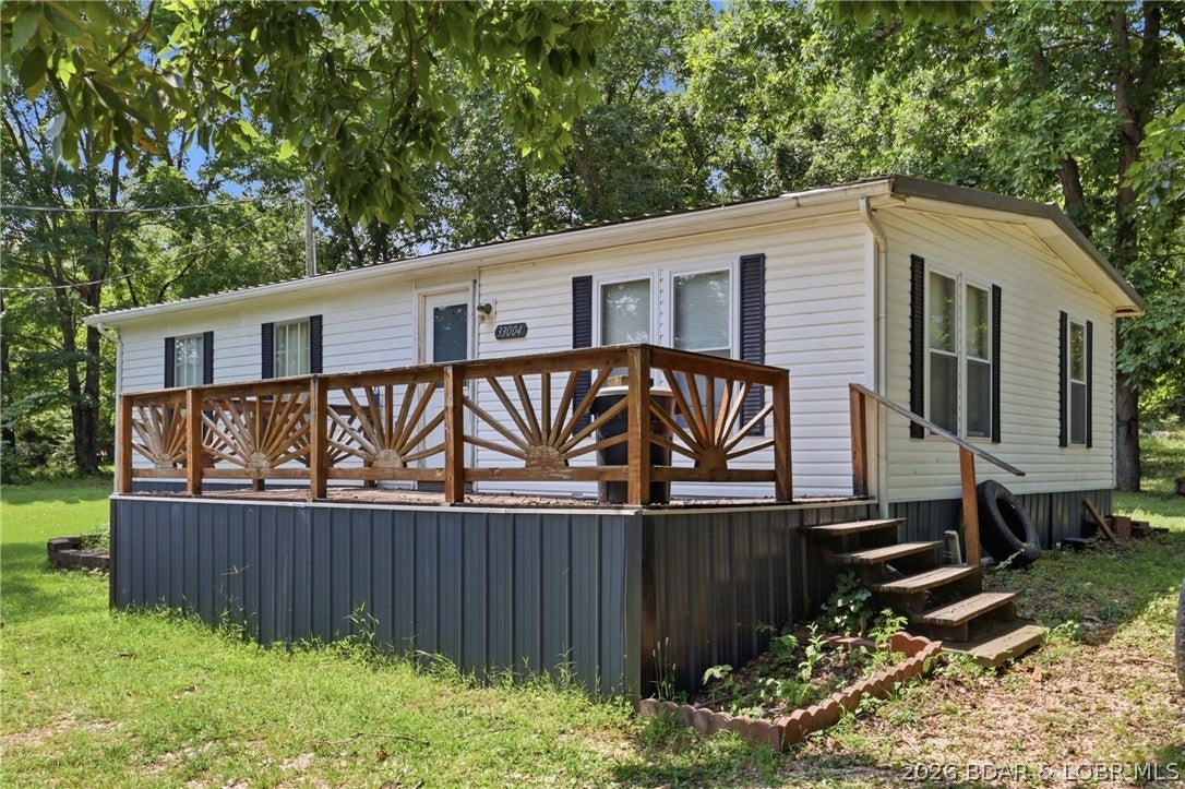 Priced for an immediate sale! Catch the best of summer and fall at Lake of the Ozarks in this beautiful 3BR/2BA second-tier home. Enjoy gorgeous lake views and effortless water access without the high lakefront taxes. The modern updates make this home perfect for entertaining, featuring an open kitchen and nice deck made for lake life. Whether you are looking for a profitable vacation rental, a weekend getaway, or a permanent lake retreat, this property delivers unmatched value. There is no HOA and boat slips are available at both Patriot Point Marina as well as, Surfside Bay Resort and Marina. Public boat ramps within 5 miles. The sellers are motivated, and this home is priced to move quickly. Schedule your private showing today before it is gone!