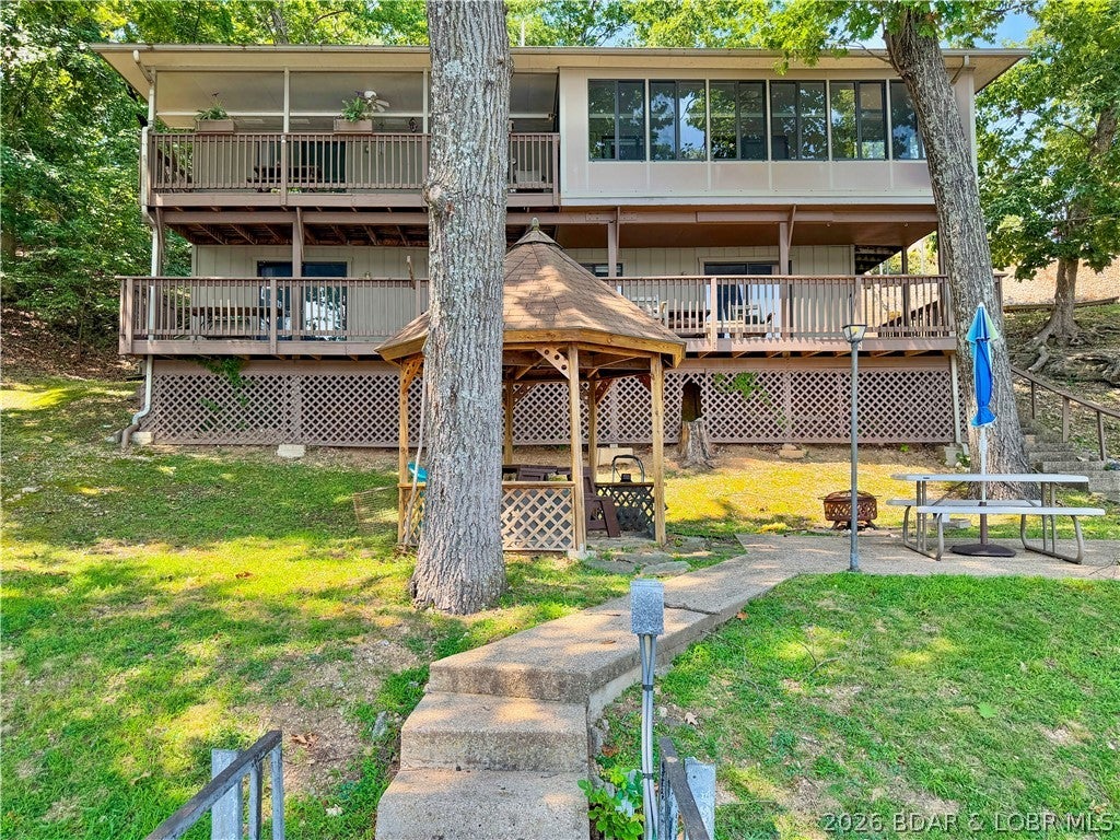 First time offered!  There’s something special about a lake home that’s been loved by the same family for generations—and this one has stories to tell. Located in the sought-after Franky & Louie’s cove in Sunrise Beach, this 4-bedroom, 2-bath home offers the kind of lake setting families hold onto: a wide, protected cove, private dock, great parking and room for everyone to gather. Inside, you’ll find a wonderful mix of original and new. The kitchen was beautifully updated in 2024, while other areas still hold onto the character and memories that make a longtime family lake house feel like home. A wood-burning fireplace sets the stage for cozy fall and winter weekends, while the full basement provides even more space and possibilities. The sunroom is the best room for morning coffee overlooking the water.  Outside, a blacktopped driveway, workshop/garage and additional detached 2-car garage give you something that can be hard to find at the lake—plenty of parking and storage for cars, boats and lake toys. Spend your days on the water, cruise over to Franky & Louie’s, then come home to your own quiet spot in the cove.