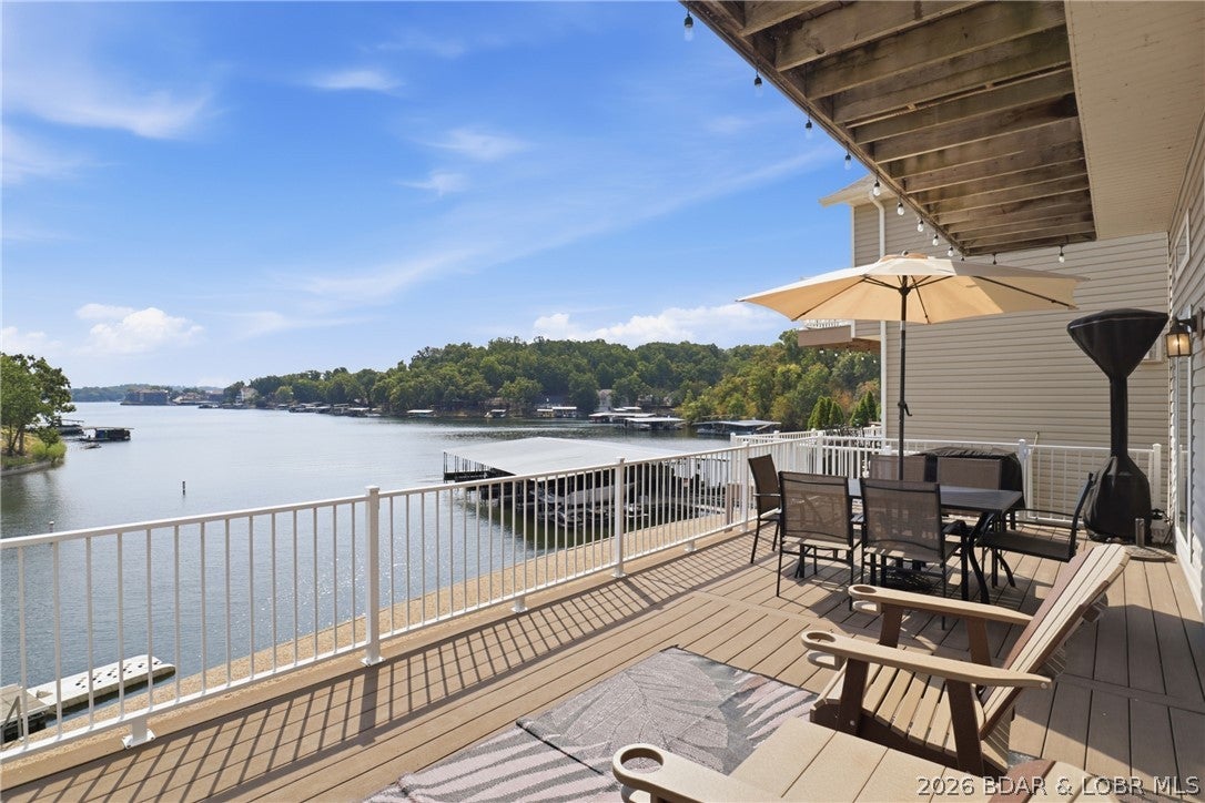 Welcome to your turnkey lakefront escape! This charming 3-bedroom, 3-bath home is nestled in a quiet cove while offering beautiful main-channel views and everything you need to start enjoying lake life from day one. The home is being sold fully furnished, including patio furniture, deck furniture, a Blackstone grill, and patio heater—just bring your suitcase and get ready for your next adventure!

A spacious 12 x 32 boat slip and PWC slip makes lake days easy and convenient, while extra guest parking and dedicated boat trailer parking add even more functionality. Located in a peaceful neighborhood known for its amazing neighbors, this property offers the perfect blend of relaxation, recreation, and community. With thoughtful mini updates already completed, this home is move-in ready, zero work or repairs to be done, and waiting for you to make it your own. Whether you’re looking for a weekend getaway, vacation home, or full-time lake retreat, this one is ready to welcome you home!