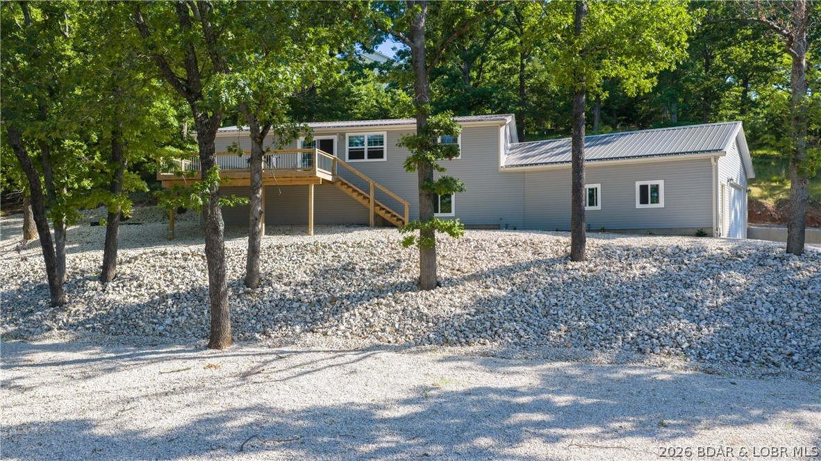 This well built 2020 home showcases quality craftsmanship and pride of ownership throughout! Offering approximately 1,600 sq. ft., this 3 bedroom, 2 bath home features cathedral ceilings, large deck, an oversized 2-car garage and sits on a spacious 3/4 acre lot with plenty of parking and a long driveway for convenience. The exterior has been beautifully finished with attractive white rock landscaping for low maintenance and great curb appeal.  You’ll appreciate the energy efficiency of spray foam insulation. The crawl space has been thoughtfully improved with spray foam insulation, vapor barrier, and a dehumidifier system. The home is serviced by a 300’ deep well and an LPP septic system featuring two 1,000 gallon tanks.  Enjoy seasonal lake views in the winter along with lake access that includes a community boat ramp and day dock. Whether you’re looking for a full time residence or weekend getaway, this newer home offers comfort, quality, and a peaceful setting close to the water!