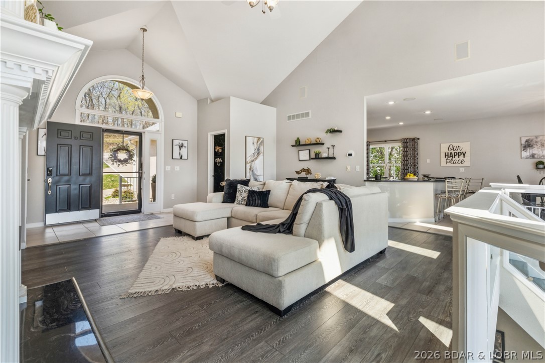 Price Improved to $1.499M—an exceptional opportunity to own one of Osage Beach's most impressive lakefront estates. Tucked inside a private gated community on 1.19 acres, this turn-key luxury home offers 271 feet of shoreline, a rare private beach, and the perfect blend of elegance, privacy, and convenience. With 4 bedrooms, 3.5 baths, including 2 en-suites, and nearly 3,000 sq ft, every detail is designed for effortless lake living. The open main level is filled with natural light from a wall of windows framing breathtaking lake views, while the walkout lower level features a spacious entertaining area with a large bar and second laundry room. Outdoor living is just as spectacular with expansive upper and lower decks, a huge screened porch off the kitchen, and a cart path leading to the deep-water concrete dock with 3 slips. Located in the heart of Osage Beach, you're minutes from shopping, dining, golf, and entertainment, yet surrounded by the privacy and tranquility that make this property truly one of a kind.:::