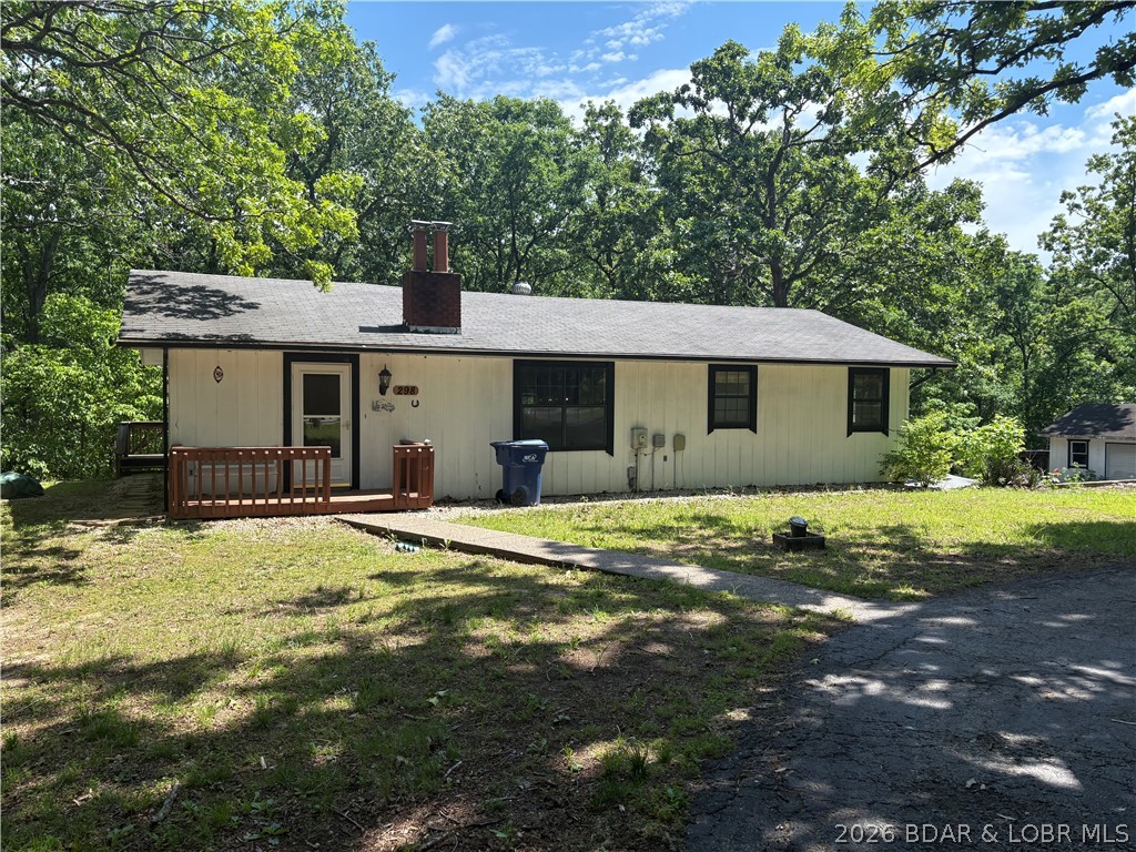 Property offered in as-present condition—an outstanding opportunity for investors, flippers, or buyers ready to unlock serious potential. Endless potential with this 2-bedroom home featuring a non-conforming bedroom that opens the door to a true 3-bedroom layout, offering 1 full bath, 2 half baths, and approximately 1,742 sq ft ready for transformation. Set on 3.7 acres plus an additional 1.3-acre parcel directly across the street, this property delivers rare flexibility with flat usable ground ideal for extra parking, future building, or expanded outdoor space. This is a true fixer-upper in every sense and a chance to create real value from the ground up. Includes an attached 2-car garage, detached garage/shop with electric, and a carport for added convenience. All of this is just minutes from popular lake destinations, including Papa Chubby’s, Captain Ron’s, and other local favorites, offering quick access to dining, entertainment, and the Lake of the Ozarks lifestyle.