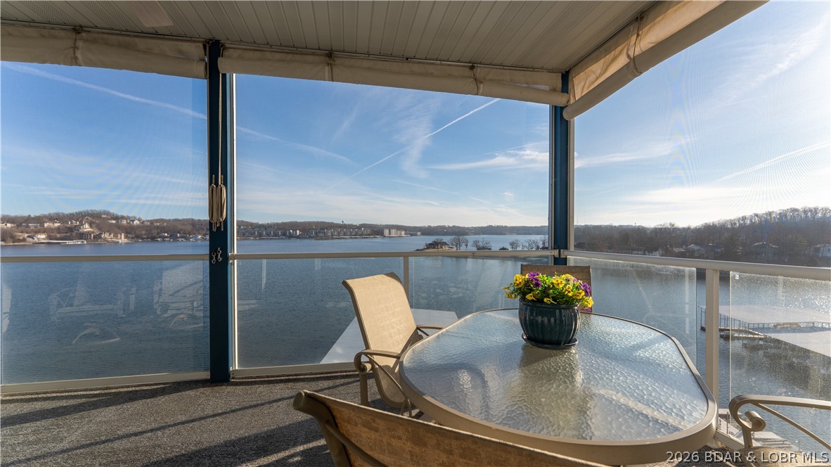 Indulge in refined waterfront living from this elegant 6th-floor, 3-bedroom, 3 bath residence offering commanding main channel views.  Arrive with ease via elevator and step into a space thoughtfully designed for those who expect the exceptional. 12x28 slip outfitted with a PWC lift. Wake each morning to the shimmer of sunrise on the water as remote-controlled blinds reveal breathtaking views. Open the double sliding glass doors to your spacious screened-in porch and let the lake breeze set the tone for the day. Entertain effortlessly with front-row elevated views of the start and finish of the Lake of the Ozarks Offshore Power Boat Races – an unforgettable backdrop for gathering with friends and family. Perfectly positioned near the Strip with its popular restaurants and shopping, this location offers both energy and convenience. With three outdoor pools on the property, you’ll enjoy resort-style relaxation without the crowds. Whether you’re boating, hosting, or simply unwinding, this residence delivers the ultimate main channel lifestyle. Also available is a hard-to-find 16x40 Cruiser slip for $45,000