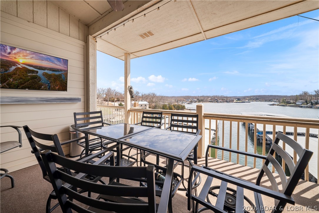 Bright, top-floor 3BR condo on Horseshoe Bend offering exceptional value at Aqua Fin Condominiums! Ideally located at the 7MM in a wide, protected cove, you’ll enjoy peaceful water views while being just steps from the energy of Shady Gators and Camden on the Lake. This well-designed unit features 3 bedrooms, 2 full baths, vaulted living room ceilings with indirect soffit lighting, and an open layout perfect for relaxing or entertaining. The kitchen offers added counter space and storage, plus a wet bar for hosting. A full-size laundry room adds everyday convenience. Step outside to both covered and open deck areas with a storage closet—ideal for soaking in the lake views. Aqua Fin amenities include two spacious pool areas, a lakeside boardwalk, and a large gazebo for gatherings. Sold turnkey and ready to enjoy, complete with a 12x28 boat slip and hoist. Looking for an affordable weekend escape, this one checks all the boxes! Schedule your showing today!