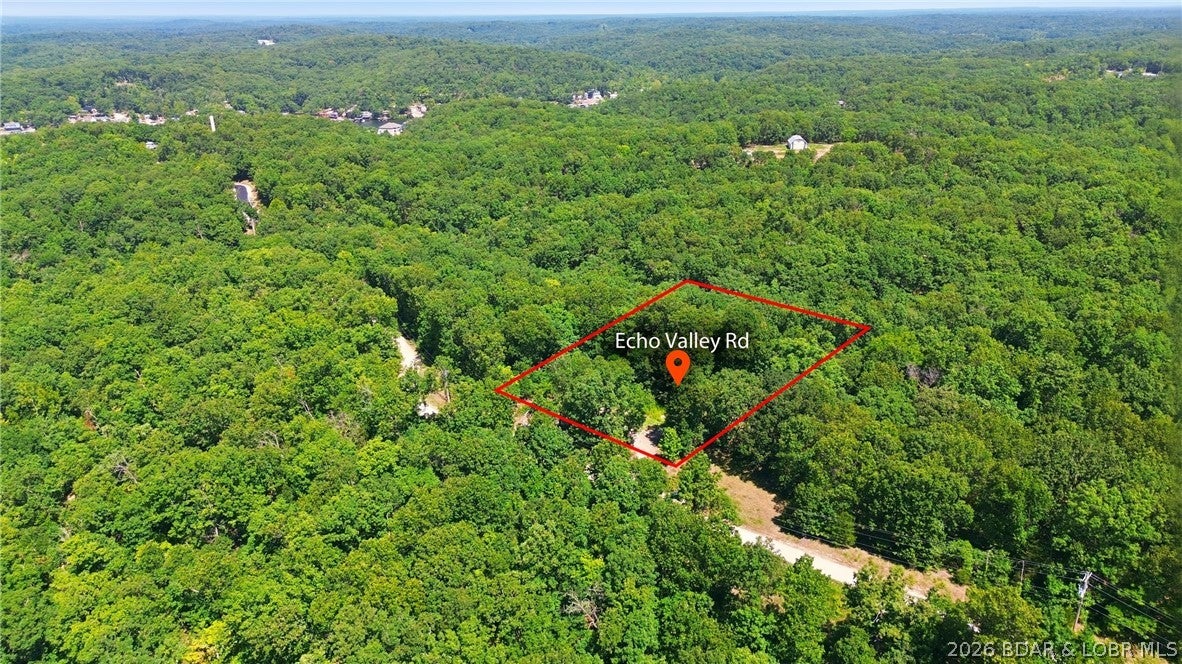 This level, versatile lot presents an excellent opportunity for building, investing, or creating a custom getaway. Conveniently situated just off blacktop roads and backing to Timberlake Village, this property offers easy access to local amenities: enjoy a convenience store with fuel and groceries within 7 minutes, Coffman Beach Access in 12 minutes, Bagnell Dam in 15 minutes, and Eldon in approximately 20 minutes. The site is well-suited for a new home, garage, or the placement of a manufactured or modular home. Camper use may also be an option. Electricity is readily available nearby.