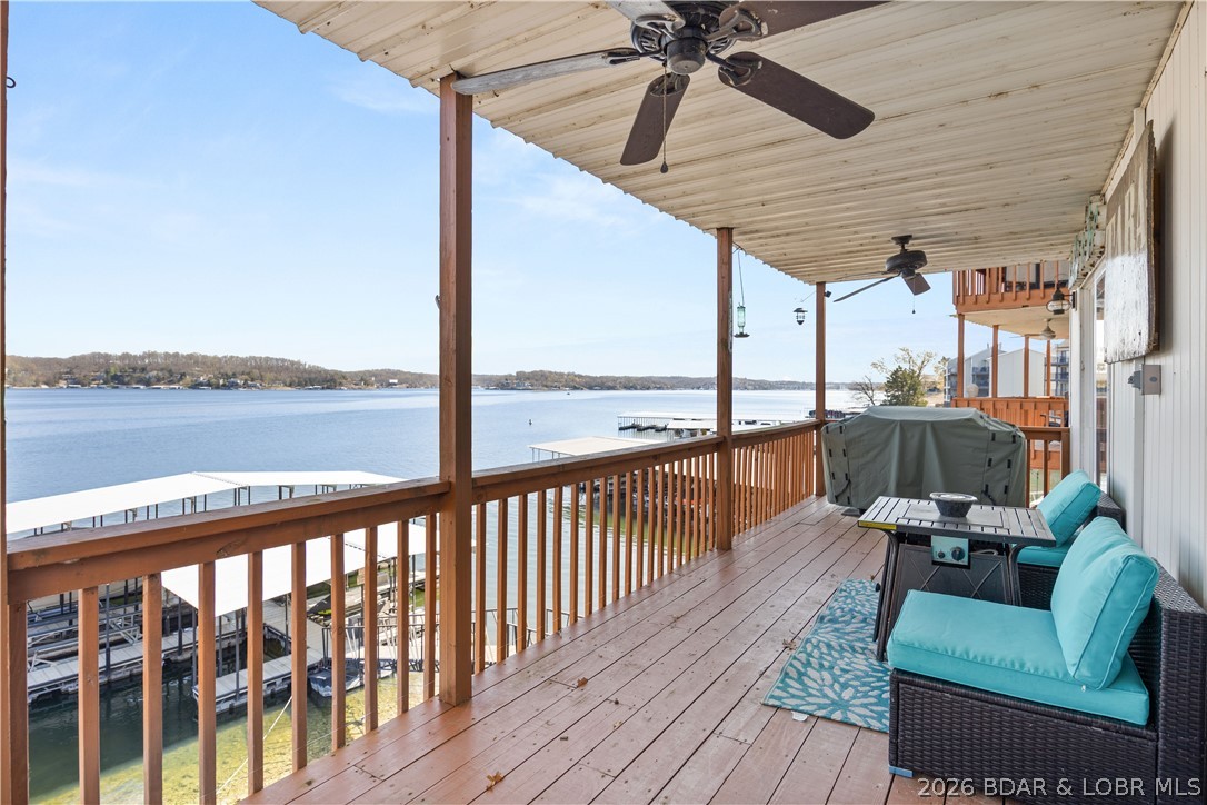 Experience the ultimate Lake of the Ozarks lifestyle at Tara Condominiums! Nestled at the 3MM in Lake Ozark, this quaint, character-filled complex offers some of the most breathtaking, miles-long views on the water. This newly updated 1-bedroom, 1-bathroom condo comes fully furnished and turnkey—just bring your bags and start relaxing. Inside, discover a "rustic meets lake" vibe featuring an open floor plan, sleek granite countertops, crown molding, and high-quality finishes throughout. The spacious bedroom includes a walk-in closet, and the covered lakeside deck is perfect for soaking in those endless views. For the savvy buyer, this unit offers incredible versatility as a high-potential nightly rental or an affordable private getaway. Boaters, take note: This unit includes one of only TWO of the largest slips in the community dock! The 12x28 slip features a raised roof to accommodate a larger cruiser and comes equipped with an 8,000-lb boat hoist. Located minutes from premier shopping, dining, and world-class entertainment, this is the lake retreat you’ve been waiting for. Schedule your private tour today and make the smarter move to the lake!