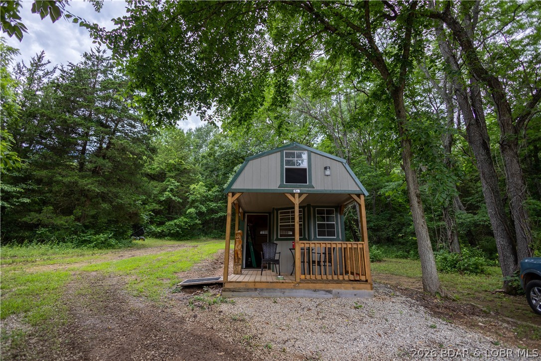 Beautiful 30 +/- acre property just minutes from Lake Ozark! The property features multiple buildings/storage sheds and some corral fencing (current owner had horses), and is comprised of a mixture of both pasture and wooded areas. If you're looking to build a home, there are multiple areas that would be perfect for creating your private retreat! Many ATV trails have been cut through the woods offering abundant opportunities for recreation or hunting and there is electrical service on the property already with internet available as well. Don't miss your opportunity to own this incredible property!