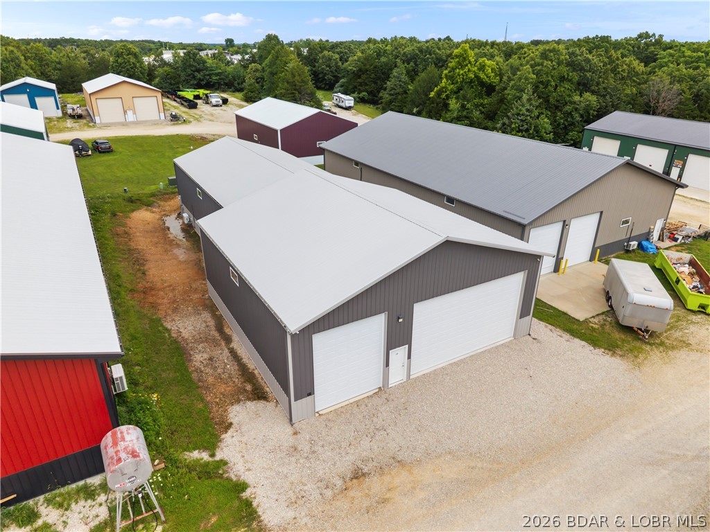 Looking for the ultimate Lake of the Ozarks storage building, workshop, or man cave? This impressive 4,000± sq. ft. insulated building offers endless possibilities and is conveniently located just minutes off Highway 42 in the heart of town of a flat easly accessable lot with no HOA or assessments. Designed for functionality, the building features two oversized electric garage doors—one measuring 24' wide x 14' tall and the other 12' wide x 14' tall—providing exceptional access for RVs, boats, trailers, heavy equipment, or large projects. Inside, you'll find two energy-efficient mini-split HVAC systems, multiple ceiling fans, and full insulation, making the space comfortable year-round. The property is well-equipped with 200-amp electrical service, welding power/service, and an impressive 96 LED lights, creating a bright, highly functional workspace. Originally constructed in 2022 w/ an addition completed in 2024, this building offers modern construction & flexibility for a variety of uses.

Whether you're searching for secure lake toy storage, the ultimate workshop, a contractor's headquarters, or the perfect man cave, this one-of-a-kind property is ready to fit your lifestyle.