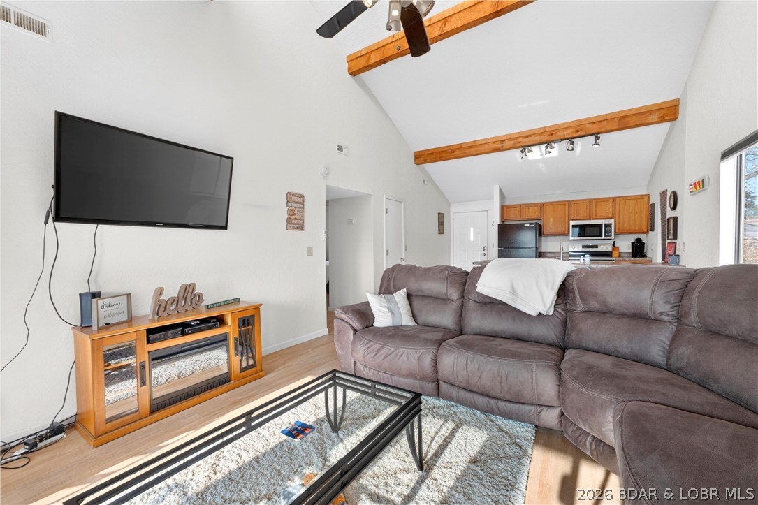 At Wrenwood Condominiums, tucked along the quieter end of Horseshoe Bend, this furnished 2-bedroom, 2-bath top-floor end unit offers a relaxing Lake Ozark retreat with investment potential. Vaulted ceilings and an open living, dining, and kitchen area create an airy, welcoming feel, while the covered deck is the perfect place to unwind with peaceful cove protection and main channel views. Rentals are allowed, including nightly, weekly, monthly, and long-term options. Owners also enjoy community amenities like 2 pools, 2 hot tubs, clubhouse, tennis courts, playground, and a covered dock with an included 10x24 slip and 8,000 lb lift.