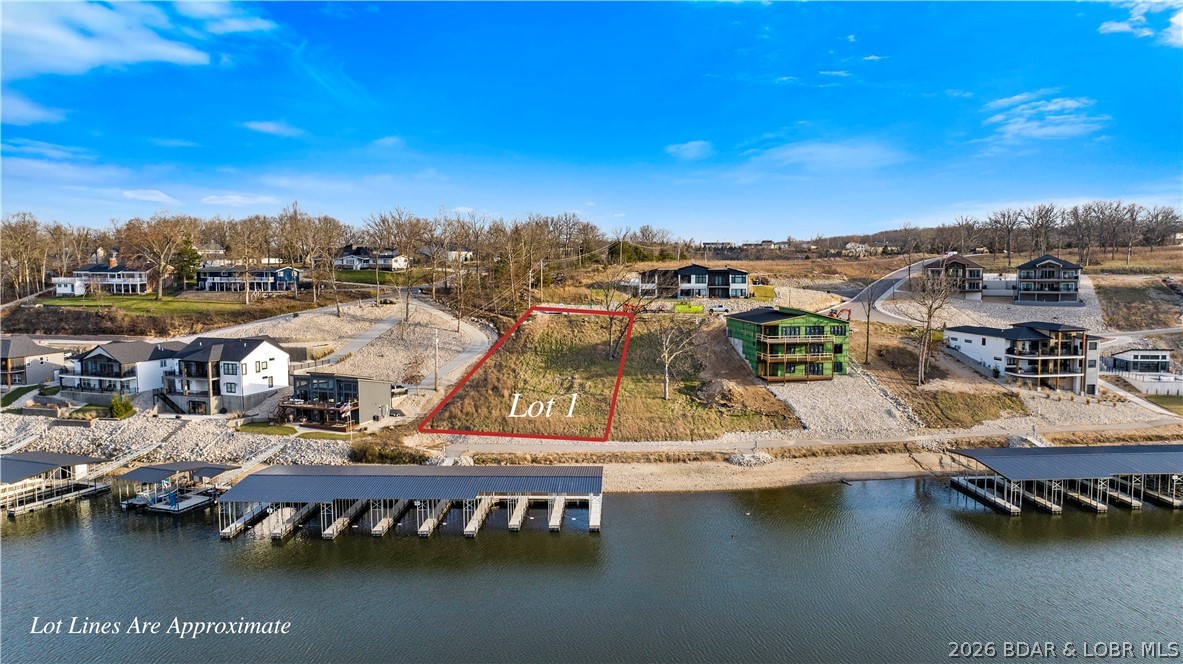 Welcome to Harpers Cov- Osage Beach's newest Lakefront, Lakeview/Lake access Subdivision located off the 18 mm of the Osage Arm. Ideal location by both land & water-only minutes by the best amenities the Lake of the Ozarks has to offer. This subdivision has great momentum- new construction homes, villas and new homeowners already enjoying Harpers Cov. Enjoy the Subdivision Lakeside pool with clubhouse, paved streets w/curbs & sidewalks, fiber optic internet, natural gas, city water & sewer, community trash & street lights. Don't miss the community park area by the Elephant rocks- a true site all by itself! Golf cart friendly with paths in place down to the community pool and docks in place (more coming soon). Build your own custom home today! Builders welcome. Numerous boat size slips available. This is what everyone has been waiting for, a centrally located place to enjoy the Lake life. Each buyer is asked to contribute $1500 towards the reserve fund at closing.