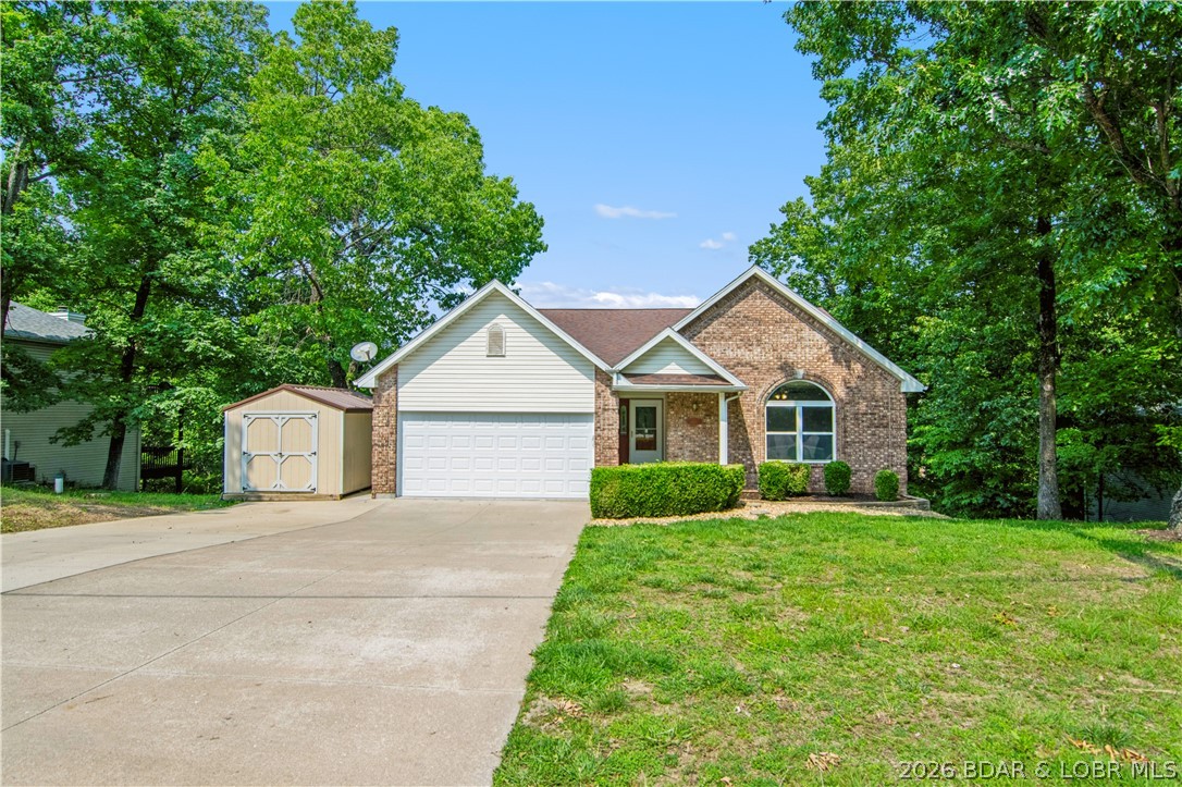 Location, space, and peace of mind — all in the heart of Osage Beach. This completely renovated home sits on desirable Bluff Drive, minutes from shopping, dining, the lake, and everything that makes the area so popular. After many years of loving the home, the sellers moved on and invested heavily to prepare it for sale — giving the next owner the rare opportunity to move right in and enjoy. Nearly everything has been refreshed including flooring, paint, countertops, appliances, fixtures, & even the furnace. Flexible layout with 3 bedrooms, kitchen, and living room on main level, plus a large lower level featuring a family room and 4th bedroom that works perfectly as guest suite. The exterior is designed with low-maintenance brick and vinyl siding, a nearly level driveway, 2-car garage, & additional storage shed. 2 large decks provide great outdoor living, including a multi-season room with sliding panels to enjoy the peaceful wooded setting. Homes in this price range are hard to find— especially in an established neighborhood within the School of the Osage district with city water and sewer. Boat slips in the neighborhood may be available. Move-in ready and priced to sell.