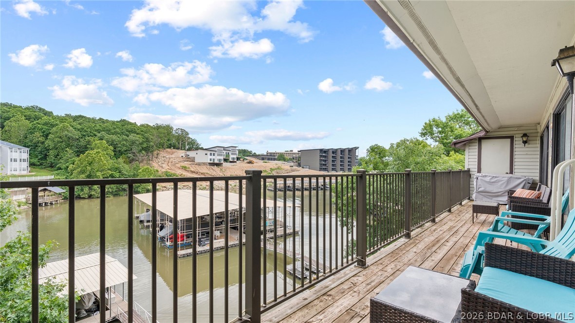 Welcome to this top floor end unit at Waters Edge Condominiums,  where you’ll experience a standout lake lifestyle featuring a scenic lakefront walking and golf cart path, a swimming pool, playground, fitness center, and both tennis and pickleball courts. This 2 bed, 2 bath condo includes beautifully updated bathrooms with walk in showers for added comfort and style. Perfect for rentals—this condo's location, convenience, and amenities make it highly attractive to vacation renters. Situated in a golf cart-friendly area, you’re just minutes from The Cove and The Ridge golf courses, plus only a short boat ride to local favorites like Lake House 13, Franky & Louie’s, and Backwater Jacks. If you’re looking for an affordable lake retreat with top-tier amenities and a boat slip, this condo is definitely worth a look! Call for a private showing today!
