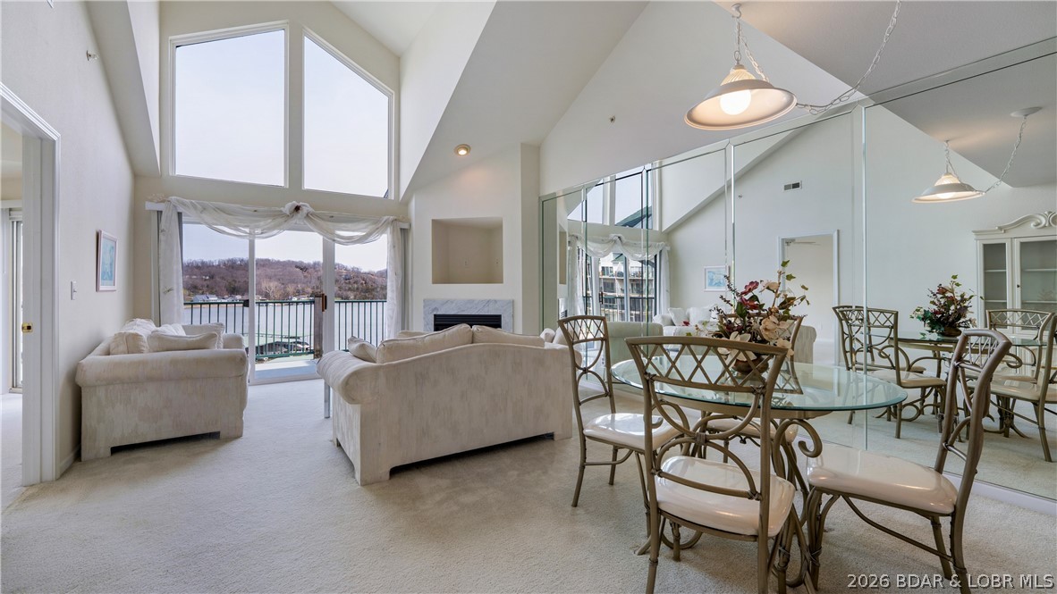 Discover this top-floor 3-bedroom, 3-bathroom condo with a spacious loft in Cedar Heights community. With a motivated seller, this is an incredible opportunity to own a standout unit at the Lake. Step inside and be greeted by floor-to-ceiling windows that flood the space with natural light and frame breathtaking panoramic views. The open layout offers plenty of room for gathering, relaxing, and enjoying the lake lifestyle. Just steps from your front door, you’ll find your boat slip conveniently located right in front of the building, making lake days effortless. The loft adds valuable extra living space—perfect for guests, a second living area, or a private retreat. Located in Camdenton on the 13 MM, this condo offers quick access to popular restaurants, golf courses, Ha Ha Tonka State Park, and all the best the Lake of the Ozarks has to offer. Whether you're seeking a full-time residence, vacation getaway, or investment property, this unit checks every box. A top-floor setting, stunning views, and unbeatable convenience—this is lake living at its finest. Schedule your appointment today! Highly sought after Garage available for additional $$.