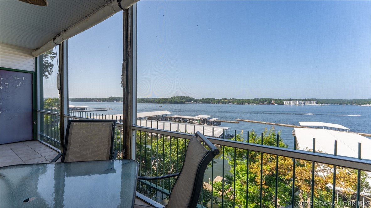 Enjoy breathtaking panoramic main channel views from this beautifully updated, turnkey 3-bedroom, 2-bath condo in the highly sought-after Harbour Towne. With only 9 easy steps from the parking lot, this inviting lake retreat offers convenient access and effortless living. Inside, you'll find an open floor plan, expansive lakeside windows, stylish updated furnishings and décor, and a spacious deck perfect for relaxing or entertaining. The lakeside primary suite features stunning lake views, a private bath, and walk-in closet. A 12x28 boat slip located directly in front of the condo is included, making it easy to enjoy every day on the water. Offering an outstanding amenity package including two heated pools, clubhouse, fitness center, tennis and pickleball courts, playground, walking trails, and easy dock access. Ideally located in Lake Ozark just minutes from Hwy 54, shopping, restaurants, entertainment, and the Bagnell Dam Strip. Whether you're searching for a full-time residence, weekend getaway, or investment property, this exceptional condo is ready to enjoy. Rental history available. Easy exit back home without a lot of traffic and this complex has great rental history.