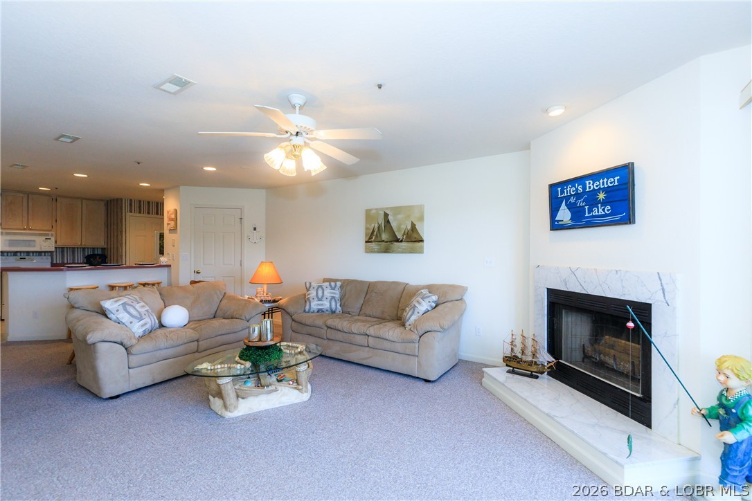 Experience the best of the Lake in this lakefront 2-bedroom, 2-bath condo located at the 5 MM of the Grand Glaize Arm. Nestled within the State Park, this property offers a peaceful setting surrounded by natural beauty while remaining just minutes from shopping, dining, & entertainment. The scenic drive through the State Park sets the tone for the relaxed lake lifestyle you'll enjoy here. Inside, the open-concept layout is designed to showcase the water, with large windows and easy access to the spacious lakeside deck. Step outside and take in stunning panoramic views of the lake. The primary suite offers a private retreat, while the second bedroom and bath provide comfortable space for guests. Whether you're looking for a full-time residence, vacation getaway, or investment opportunity, this condo offers the ideal blend of comfort, convenience, and lakefront living. Furniture included! Park Place on the Lake features excellent amenities, including a pool, clubhouse, playground, boat trailer parking, & beautifully maintained grounds. If you're looking for a place to enjoy everything Lake of the Ozarks has to offer, this condo deserves a spot at the top of your list.