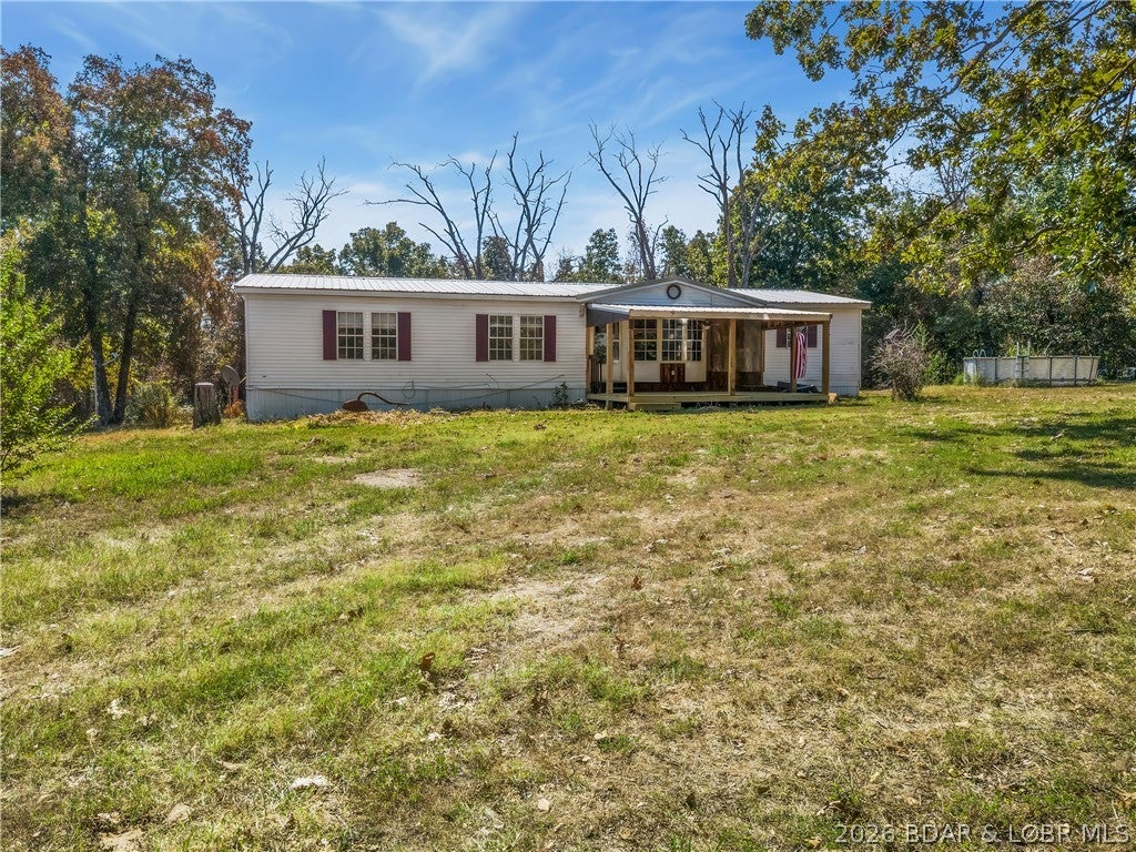 Country Home on 18.7 Acres.  Covered Deck Entry to the Living Room that has a Wood Fireplace and the Recreation Room has a Wood Stove hookup.  There is Wall Metal Barn Décor for decoration.  The Dining Room has a Bay Window & the Kitchen has a Work Island, Pantry & Granite Countertops.  The Master Bedroom/Bath has a Walk-In Closet, Walk-In Shower & double Sinks.  Included is a 10x20 Storage Shed.  The 18.7 Acres lays level with some Fencing, Fruit Trees and is open & wooded with lots of Wildlife.  Recently Surveyed.