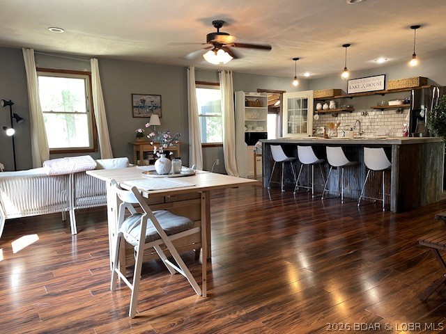 Welcome to your private retreat! This charming ranch home features 3 bedrooms and 2 baths, highlighted by an updated farmhouse kitchen with concrete countertops, a subway tile backsplash, and rustic open shelving. With ample space for relaxation and entertainment, enjoy the screened-in deck, fire pit, and spacious open living areas. The impressive 30’ x 40’ shop is a remarkable addition, boasting concrete floors, a 12’ overhead door, and a finished area that can serve as a 4th (or potential 5th) bedroom. This versatile space is ideal for RV storage, projects, or as a separate guest accommodation. Nestled on 2.5 acres in the gated Forbes Lake of the Ozarks community, you'll have access to stocked fishing lakes, Lake of the Ozarks, tennis courts, campgrounds, and an RV park. This property is perfect for outdoor enthusiasts and those seeking a peaceful lifestyle.
